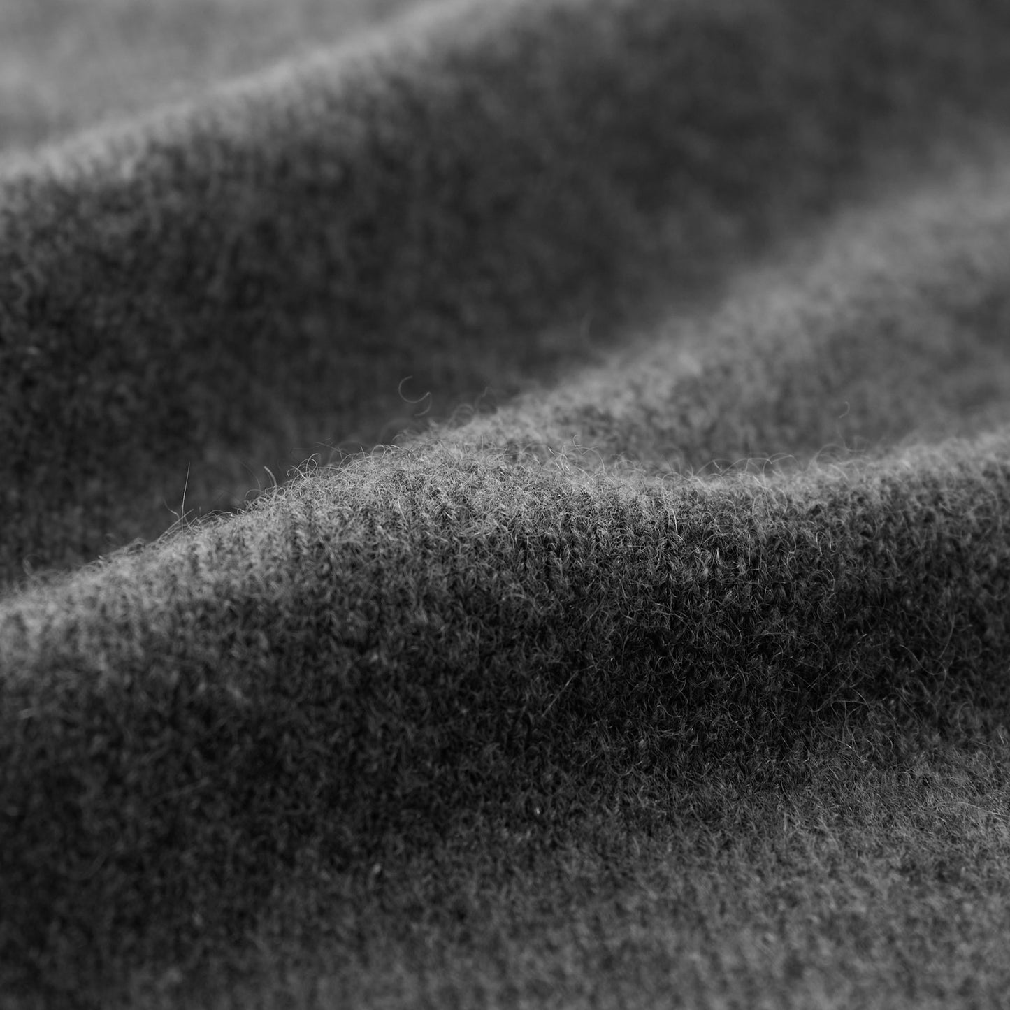 MA21 Turtleneck Cashmere Sweater by Mawei, grey, fabric texture close-up.