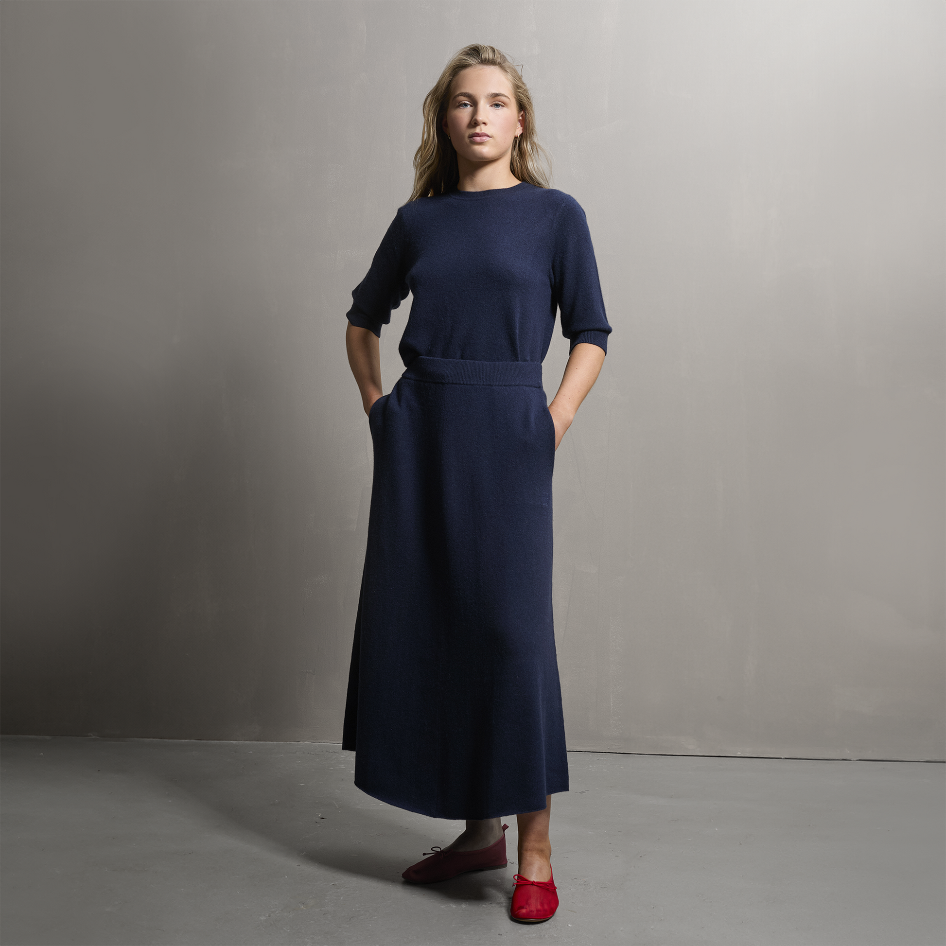 MA34 Cashmere A‑Line Skirt with pockets by Mawei, navy blue, front view, female model.