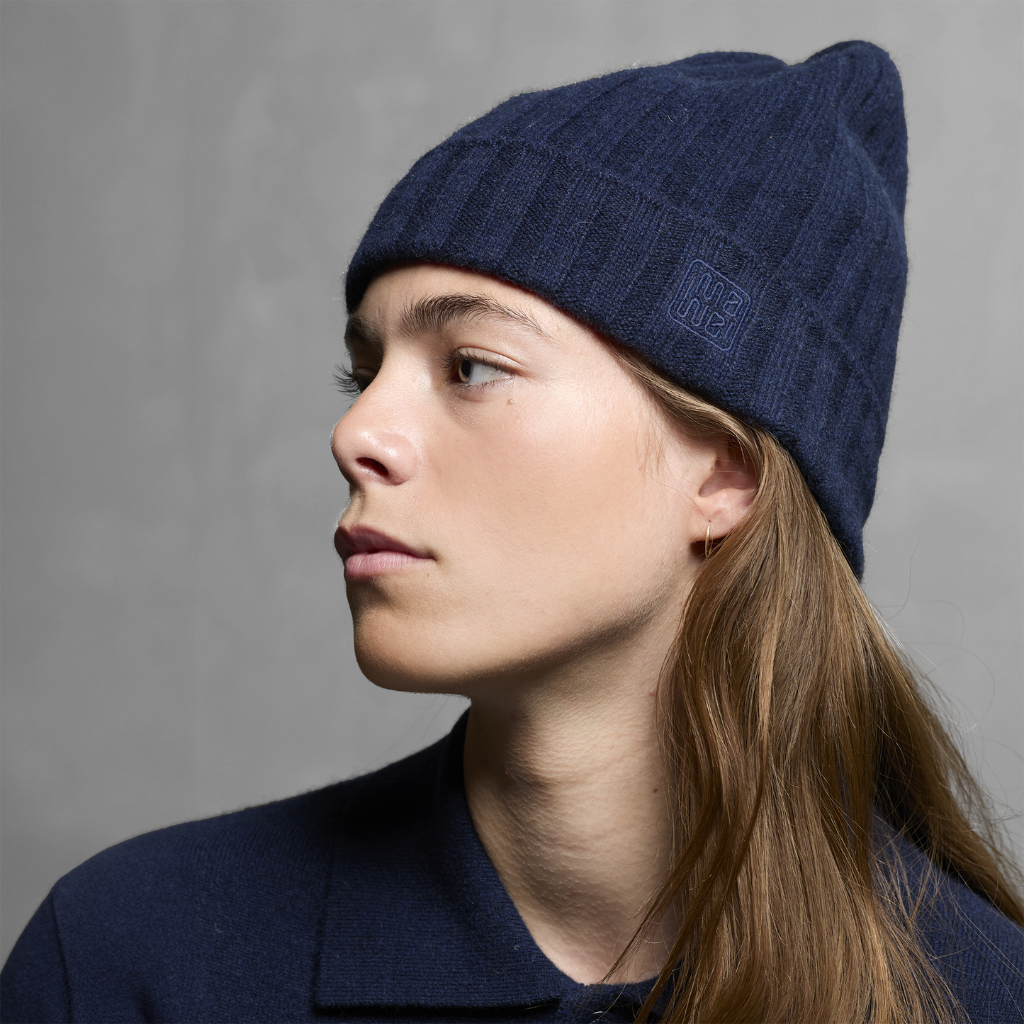 MA71 Cashmere Beanie by Mawei, navy blue, side view, female model.
