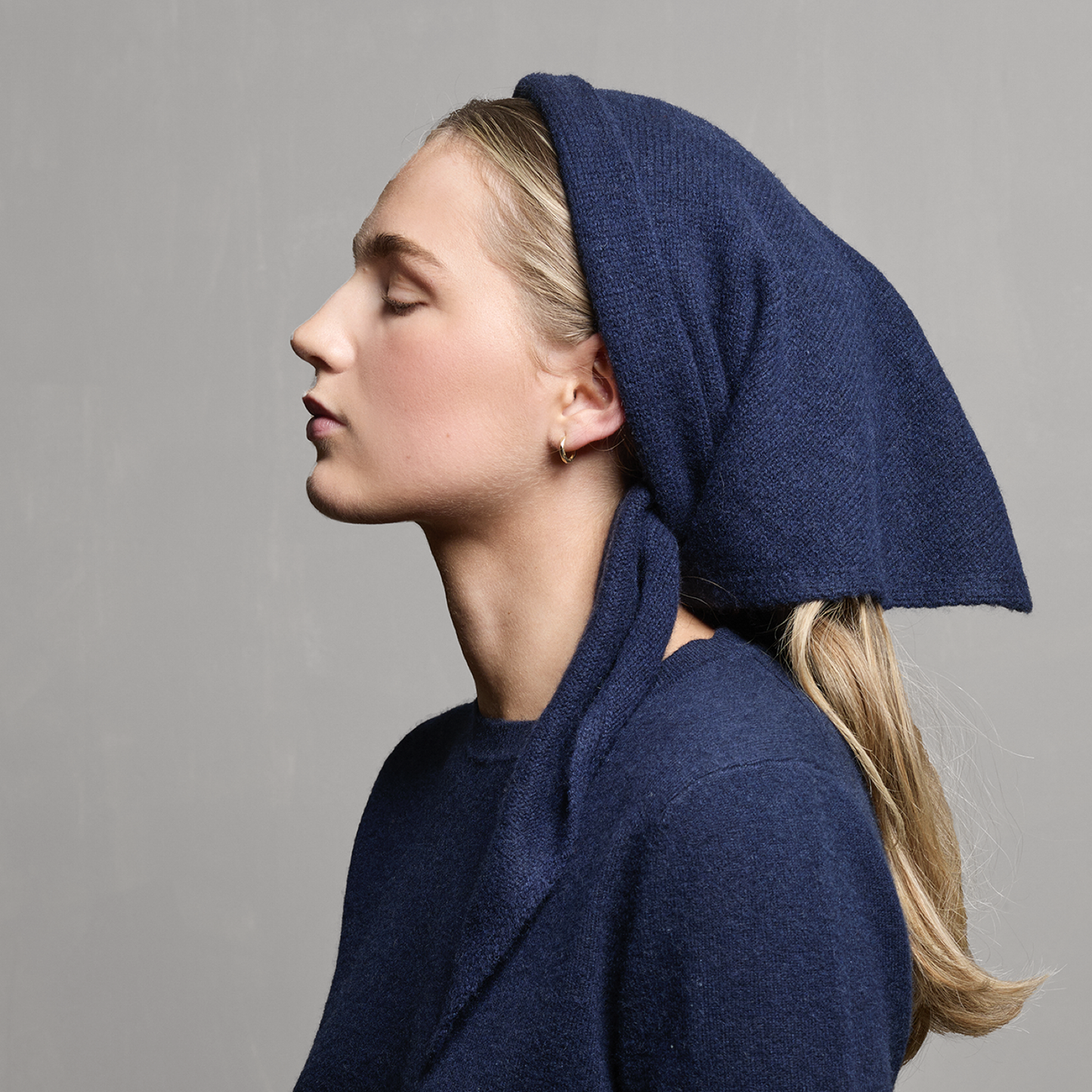 MA81 Cashmere Triangular Scarf by Mawei, navy blue, side view, female model.