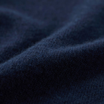 MA21 Turtleneck Cashmere Sweater by Mawei, navy blue, fabric texture close-up.