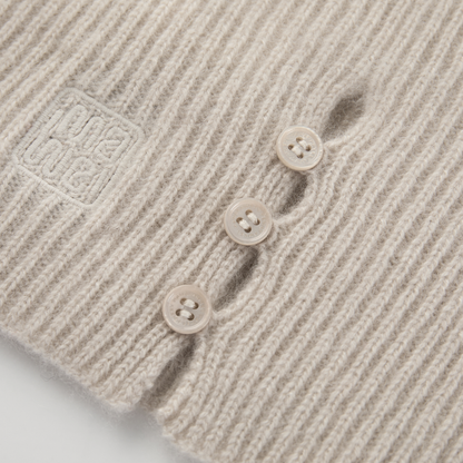 MA61 Cashmere Buff with Buttons by Mawei, off white, close-up, flat lay.