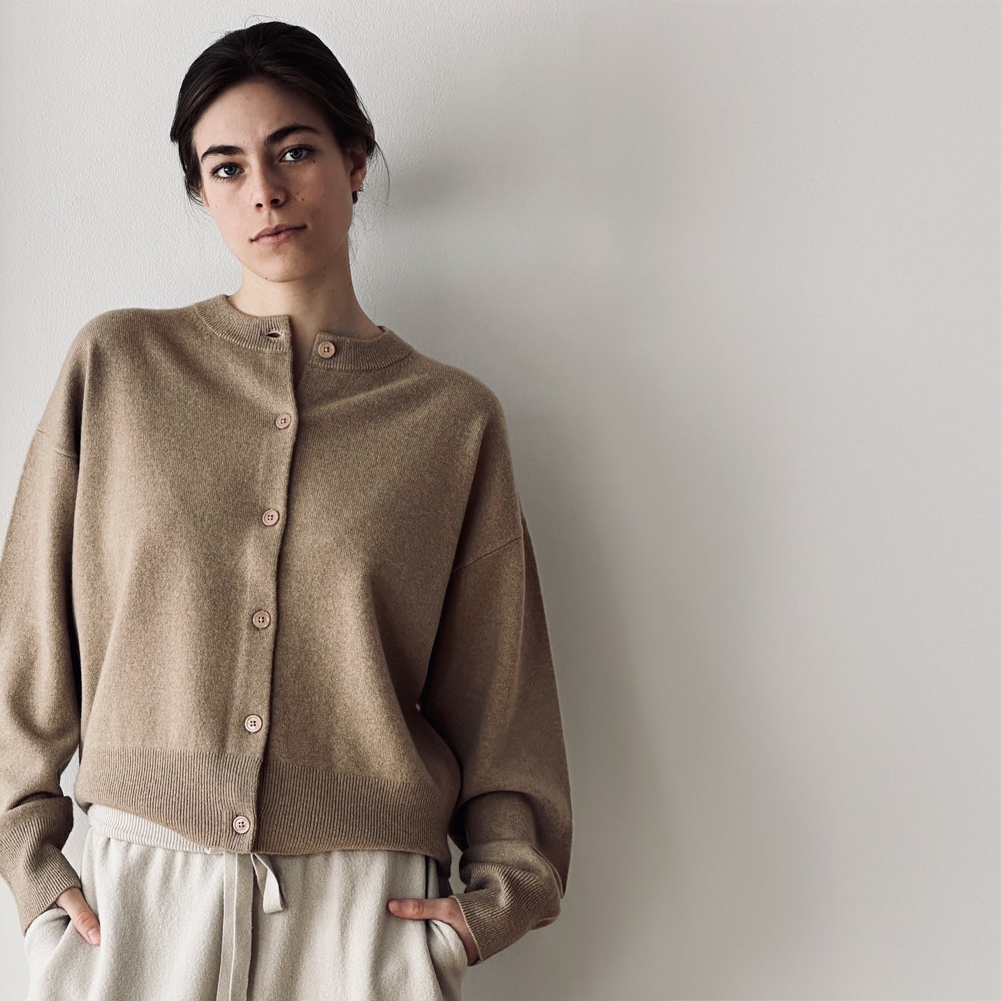 MA06 Cashmere Crewneck Cardigan by Mawei, beige camel, front view, female model.