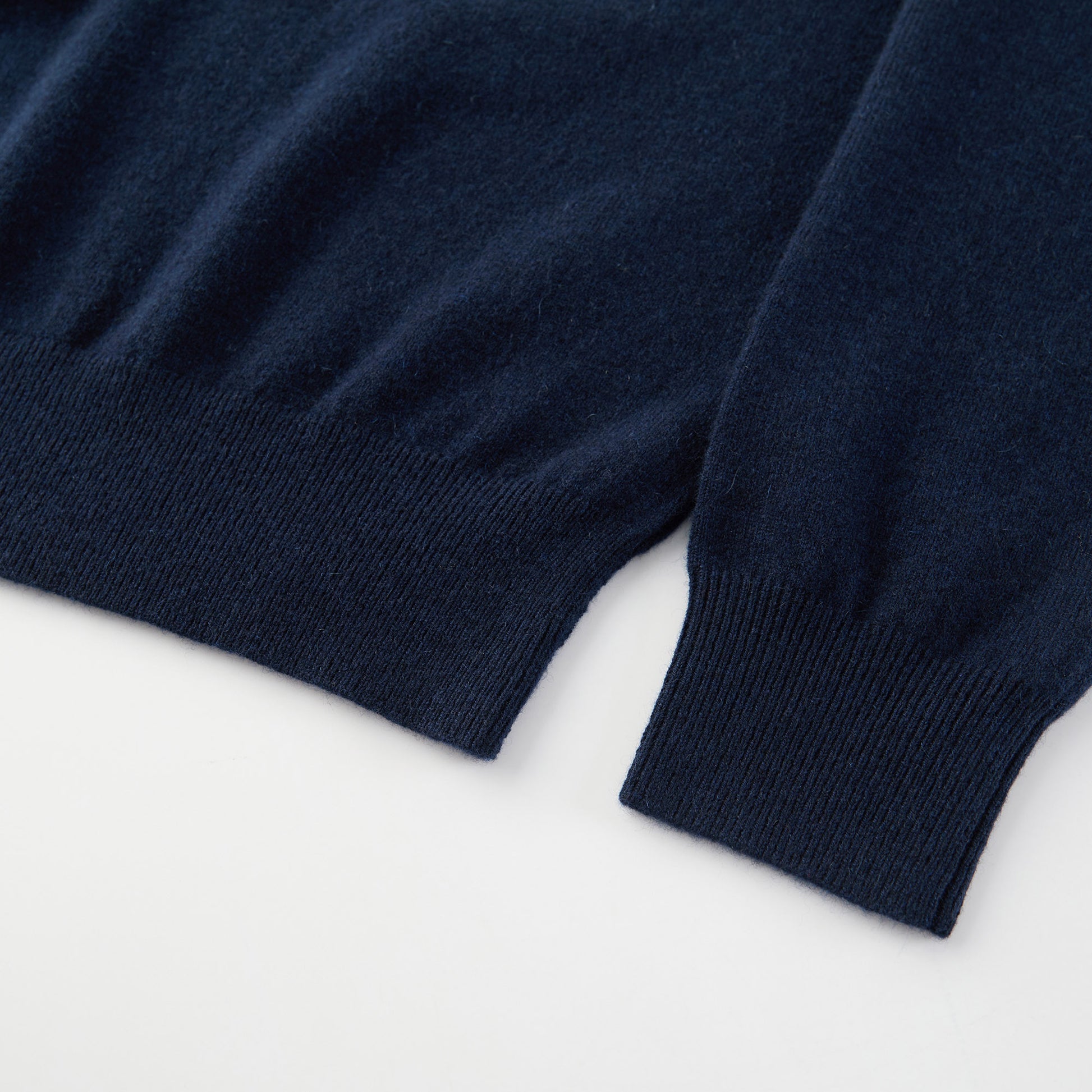 MA21 Cashmere Turtleneck Sweater by Mawei, navy blue, hem, cuff rib close-up.