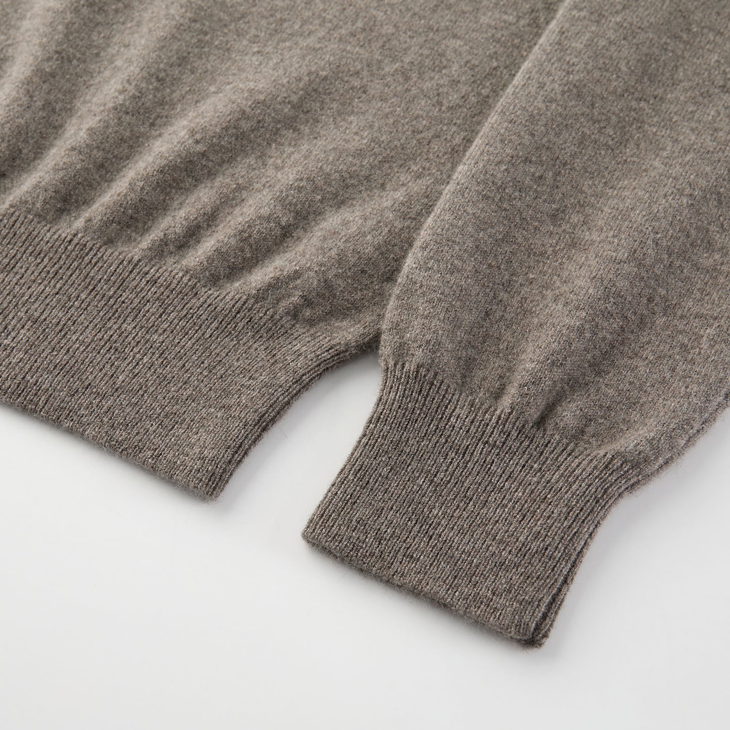 MA25 Cashmere Polo Sweater by Mawei, grey-brown, fabric texture, cuff, hem rib details close-up.