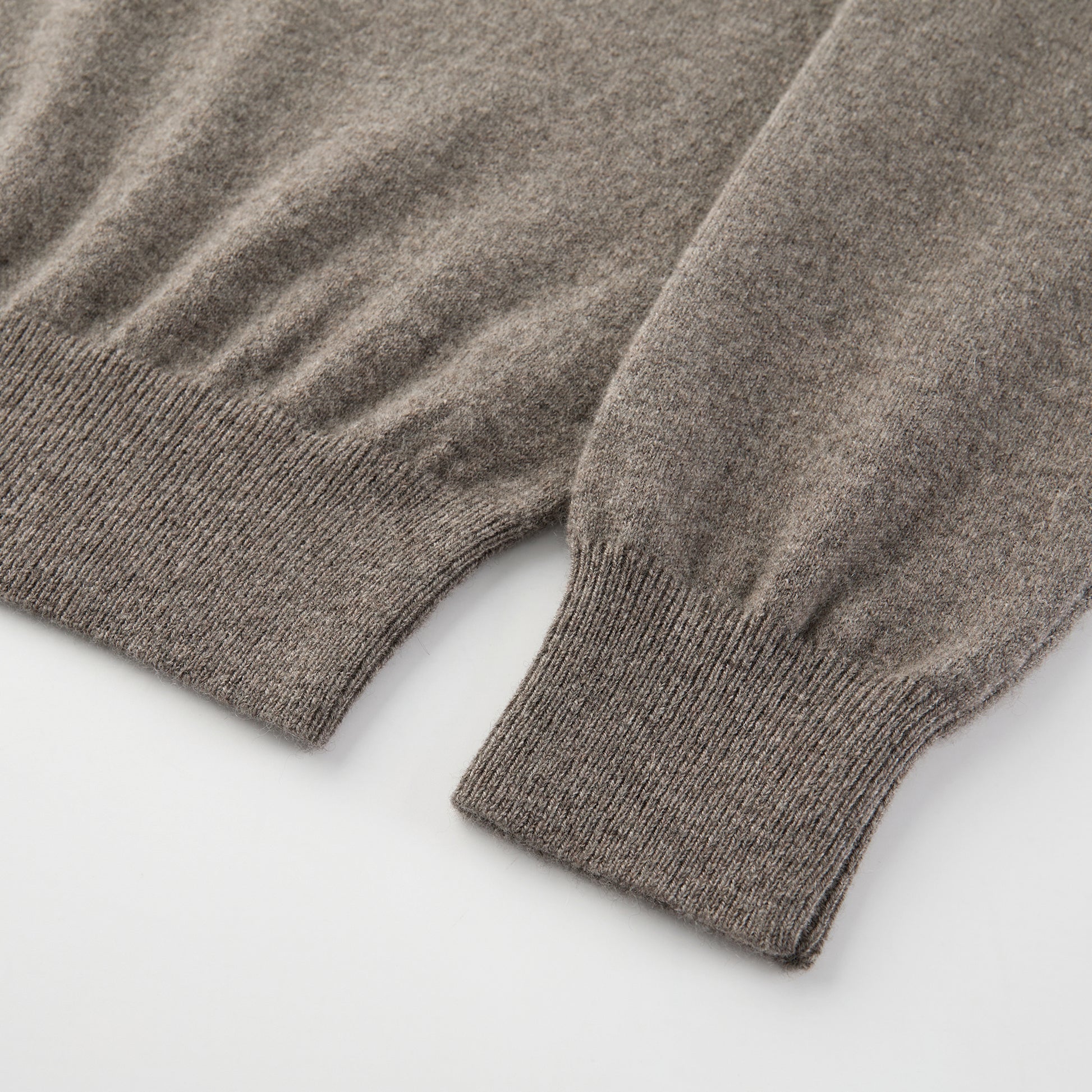 MA25 Cashmere Polo Sweater by Mawei, grey-brown, fabric texture, cuff, hem rib details close-up.