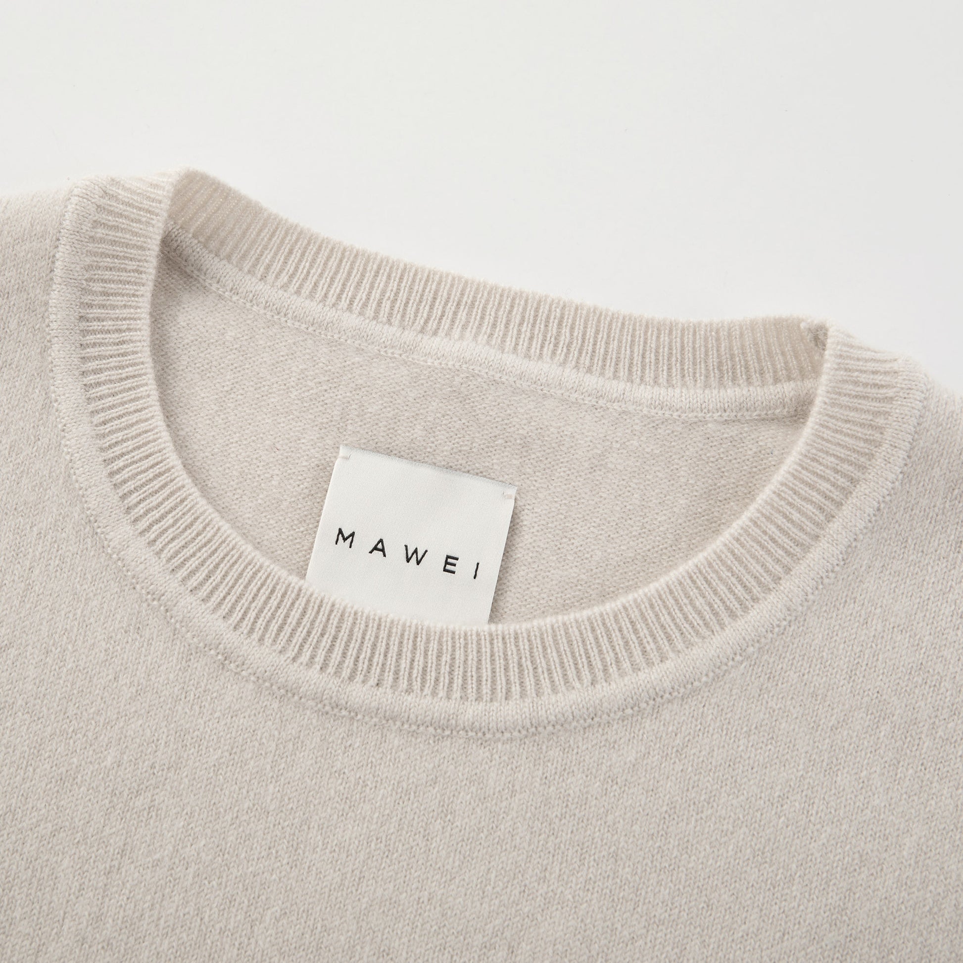 MA03 Cashmere Short Sleeve Crewneck Sweater by Mawei, off white, neck rib detail close-up.