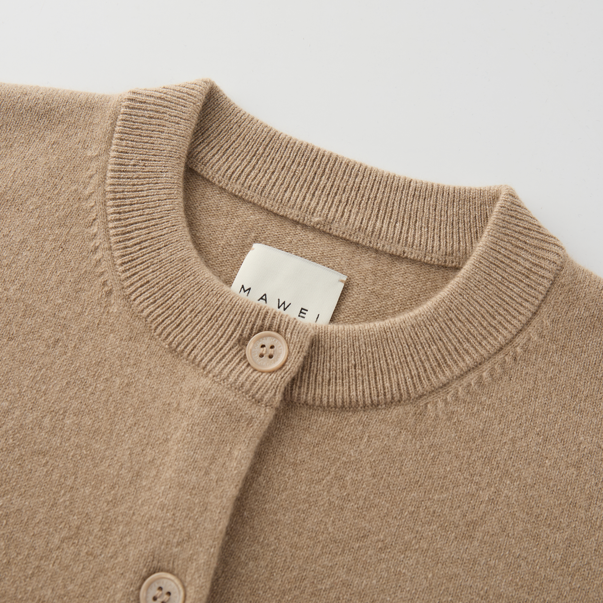MA06 Cashmere Crewneck Cardigan by Mawei, beige camel, neck detail close-up.