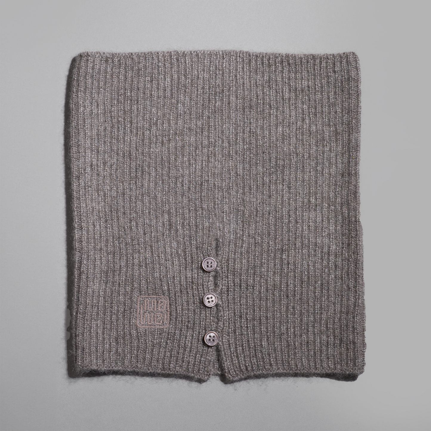 MA61 Cashmere Buff with Buttons by Mawei, grey-brown, flat lay.