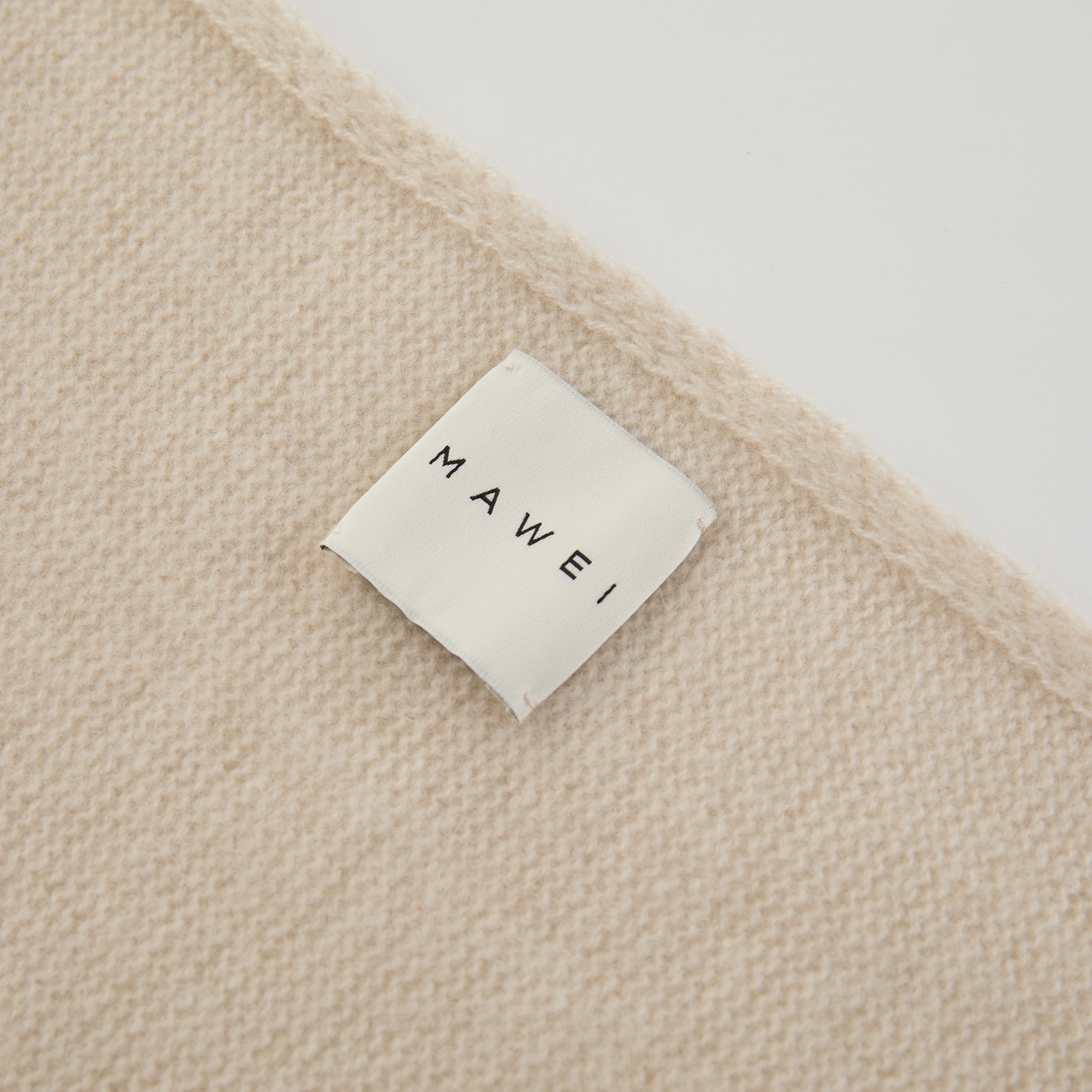 MA81 Cashmere Triangular Scarf by Mawei, off white, edge detail close-up.