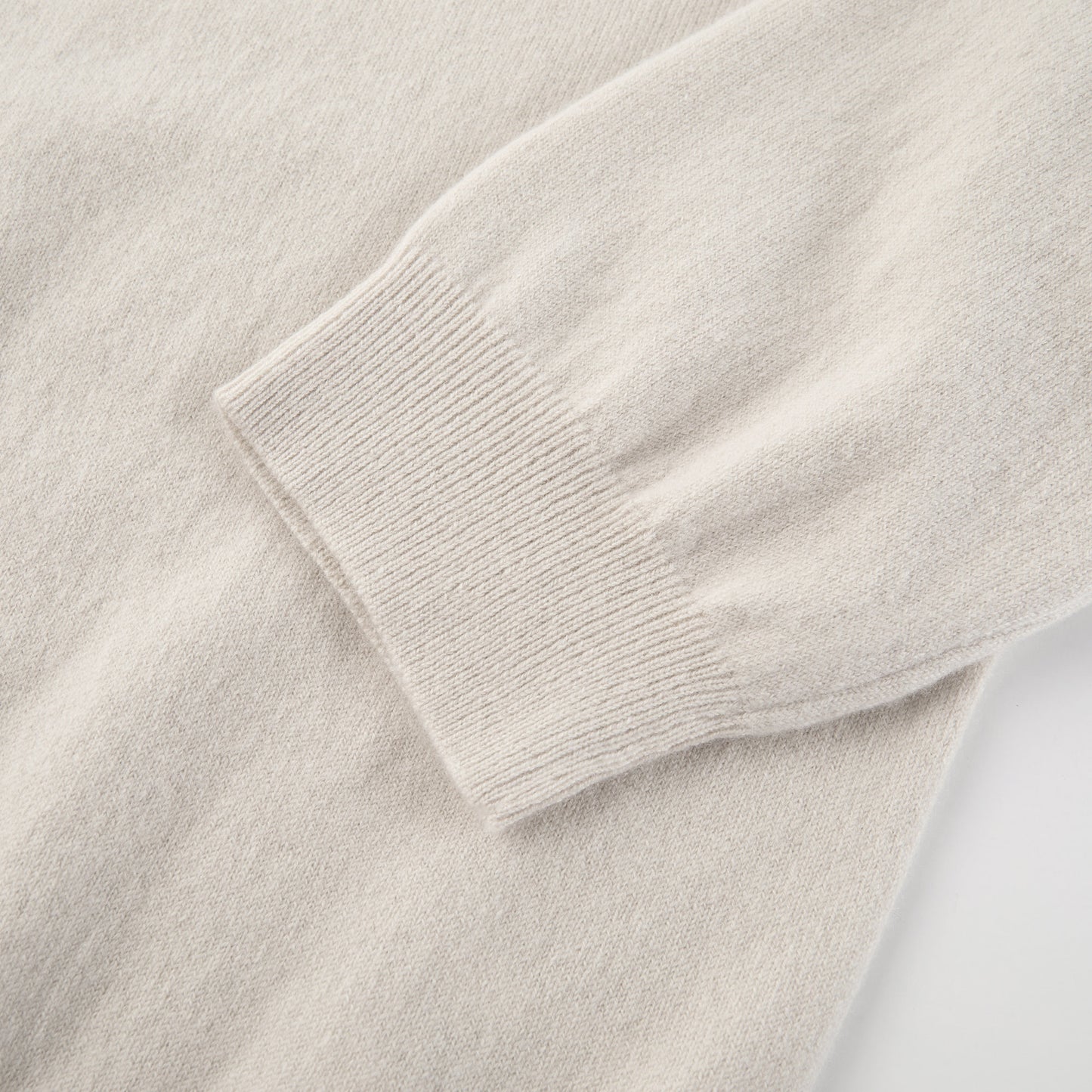 MA03 Cashmere Short Sleeve Crewneck Sweater by Mawei, off white, sleeve cuff detail close-up.