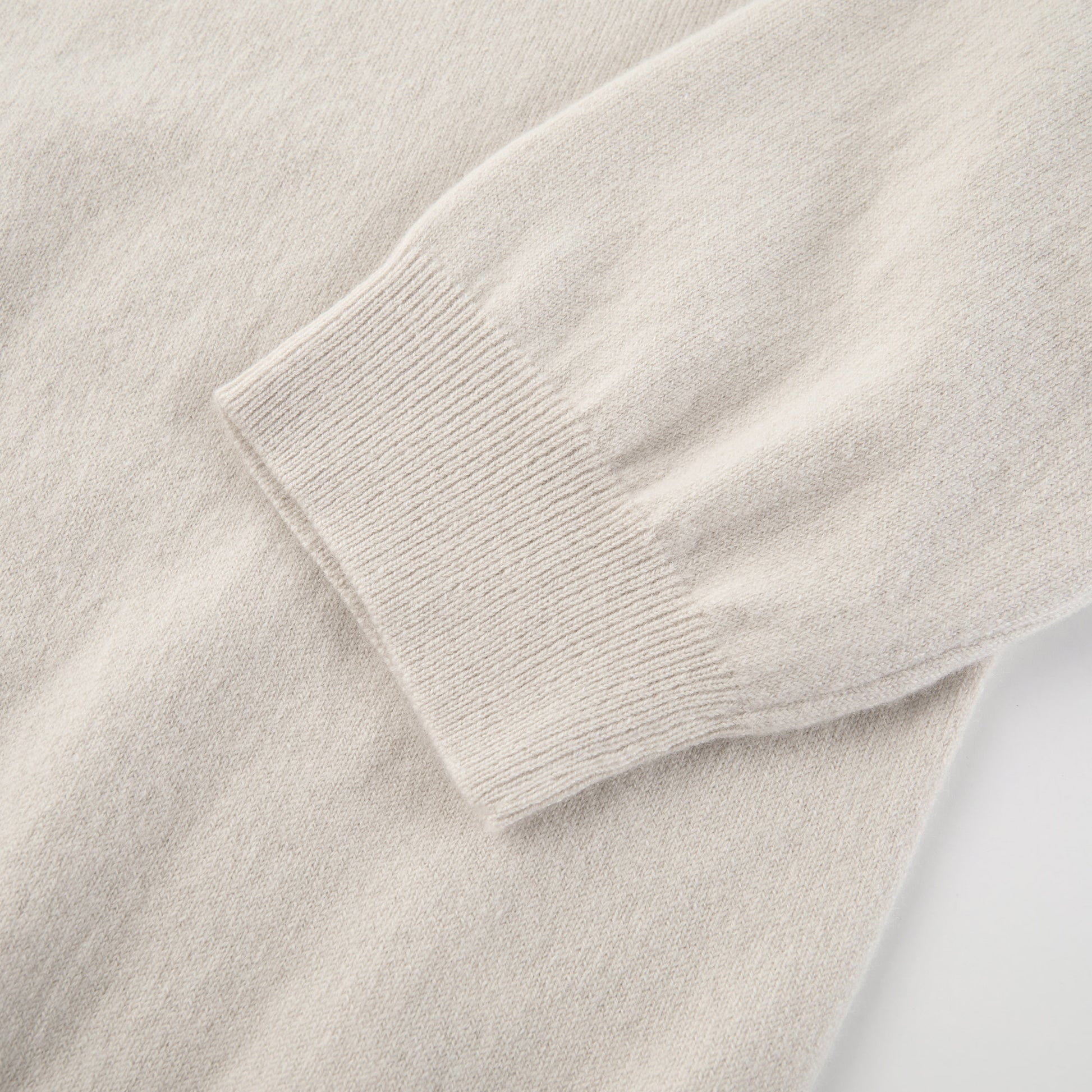 MA03 Cashmere Short Sleeve Crewneck Sweater by Mawei, off white, sleeve cuff detail close-up.