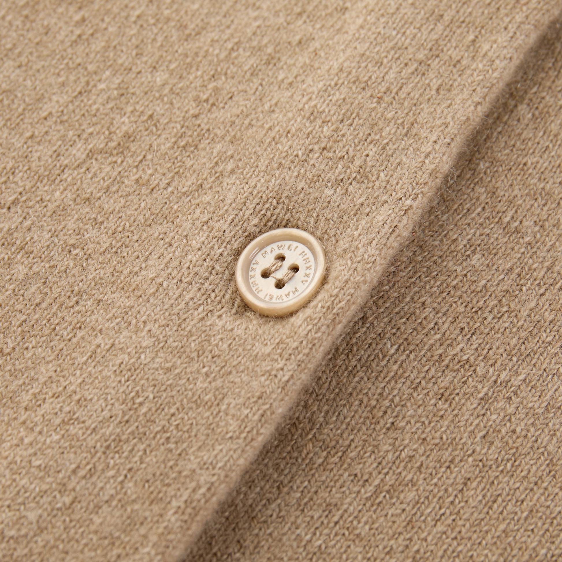 MA06 Cashmere Crewneck Cardigan by Mawei, beige camel, buttons detail close-up.