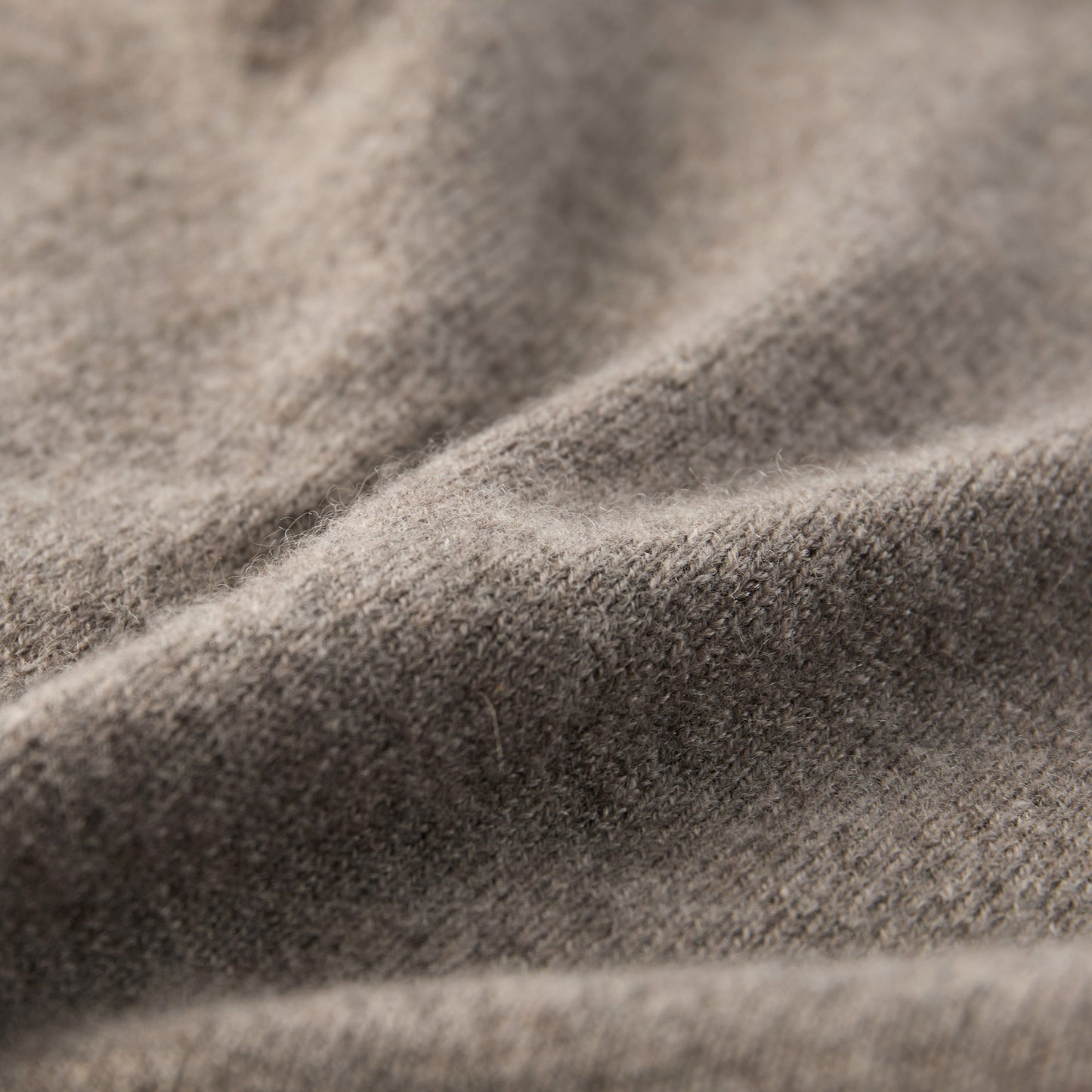 MA44 Cashmere Trousers with pockets by Mawei, grey brown, fabric texture close-up.