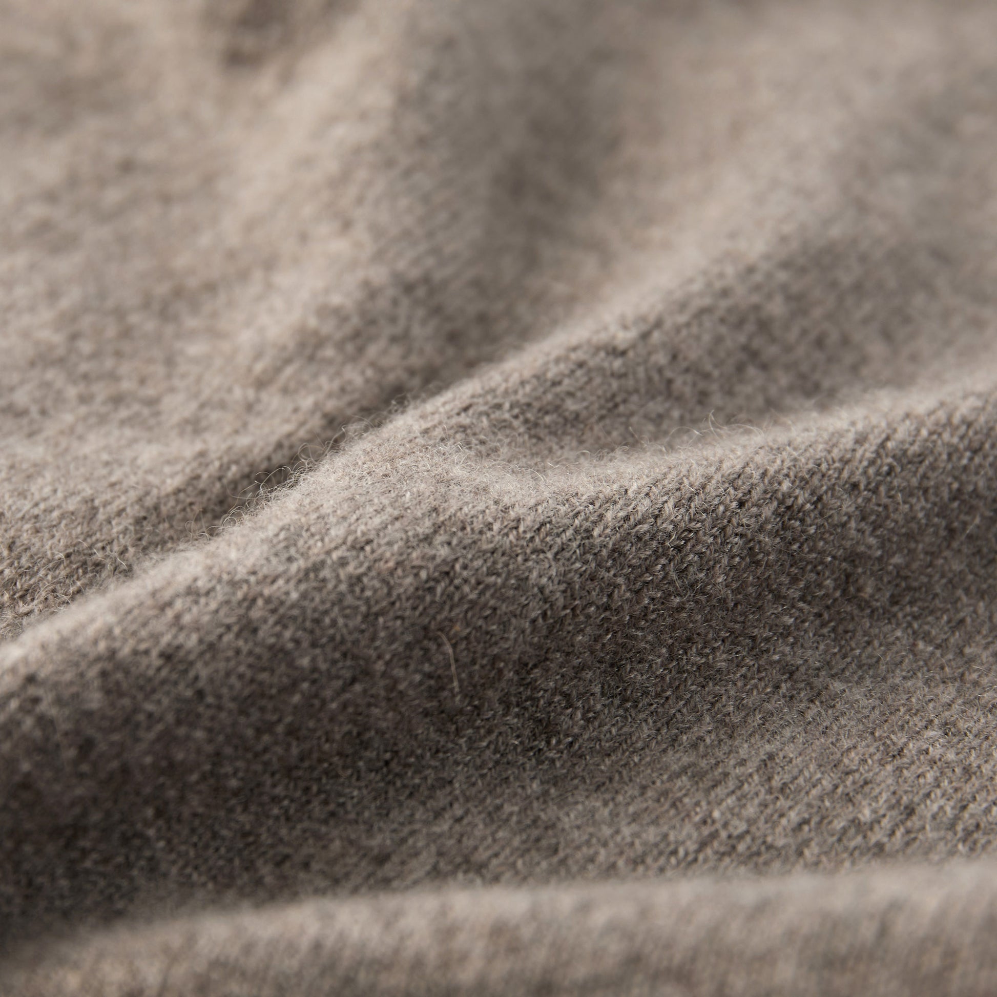 MA44 Cashmere Trousers with pockets by Mawei, grey brown, fabric texture close-up.