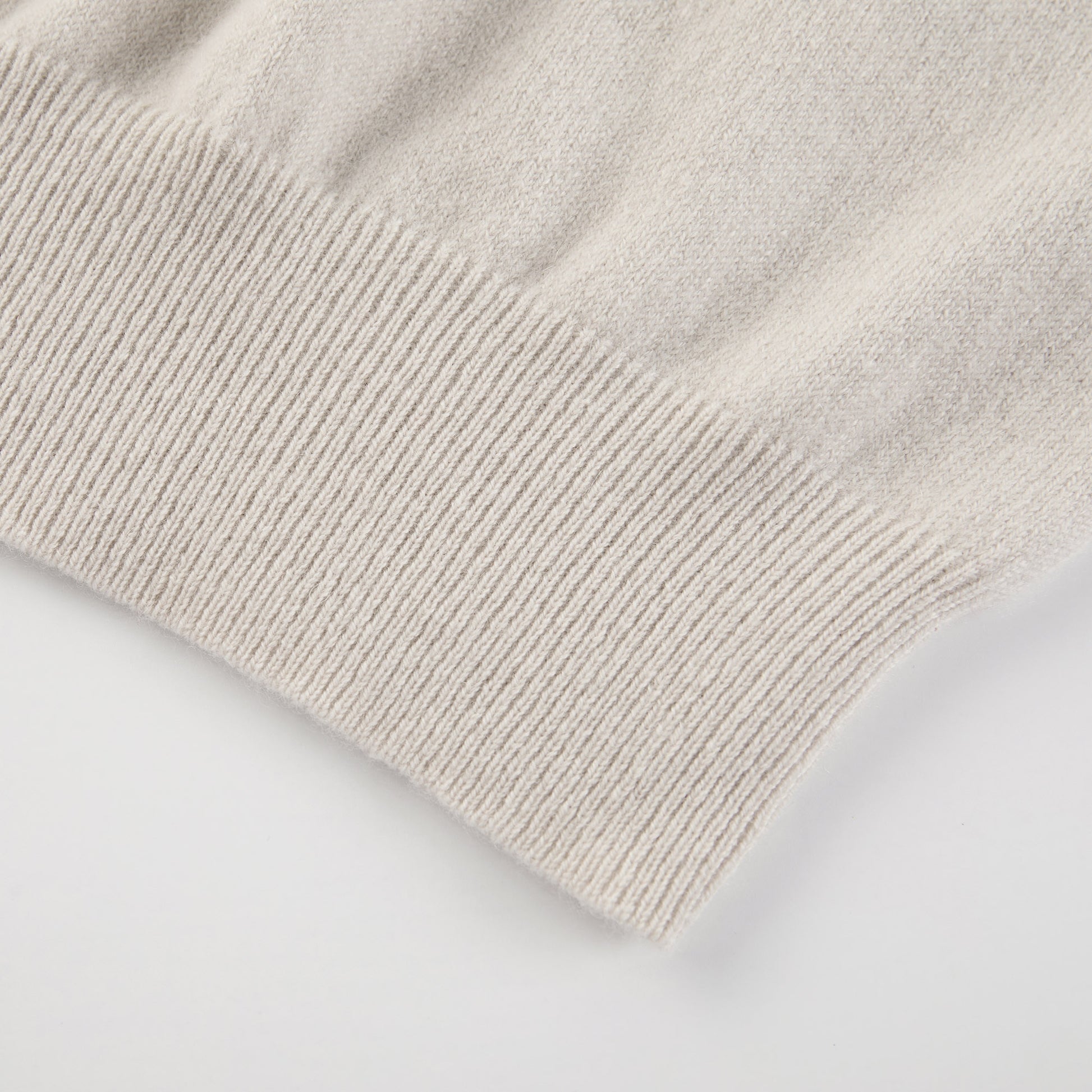 MA03 Cashmere Short Sleeve Crewneck Sweater by Mawei, off white, hem rib detail close-up.