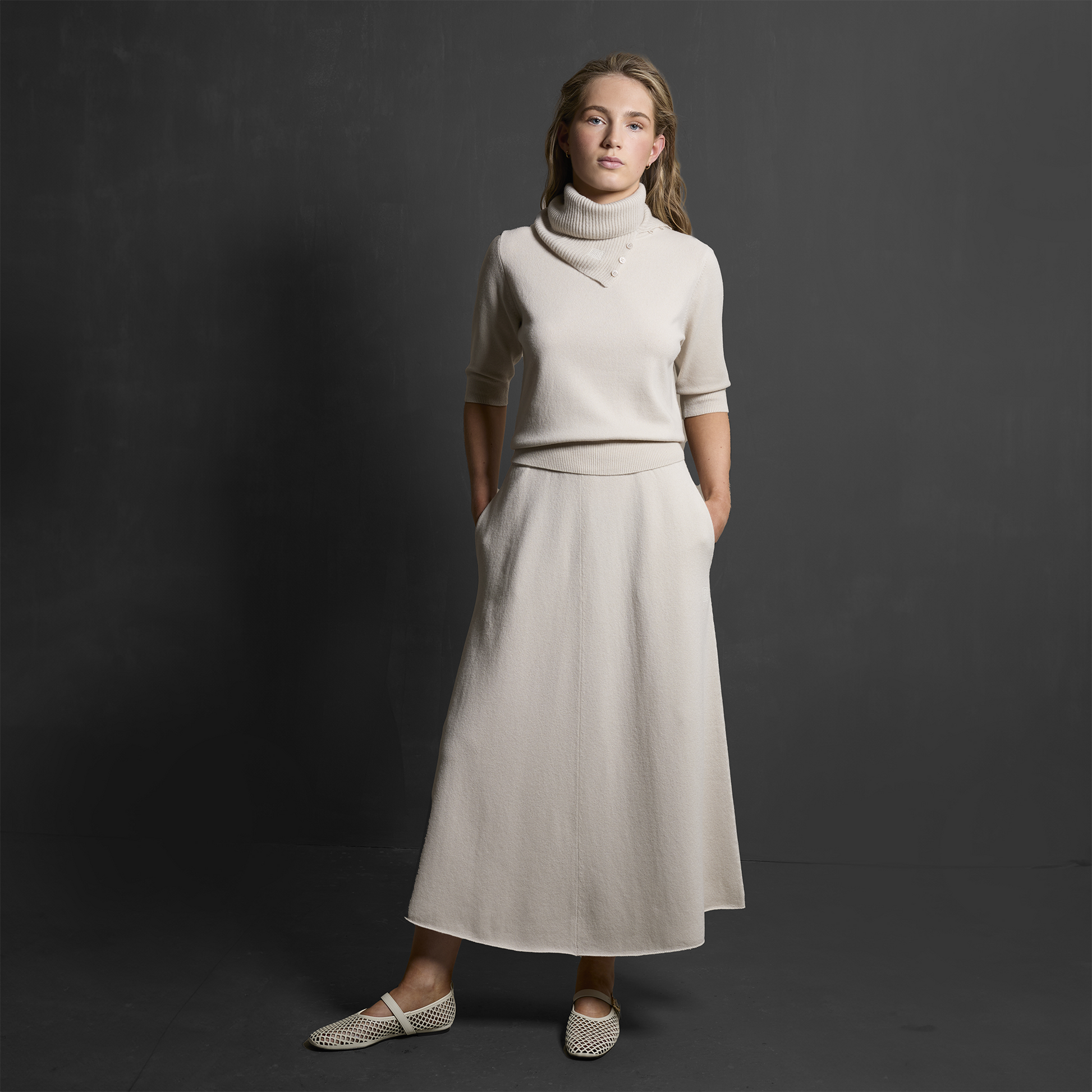 MA34 Cashmere A‑Line Skirt with pockets by Mawei, off white, front view, female model.