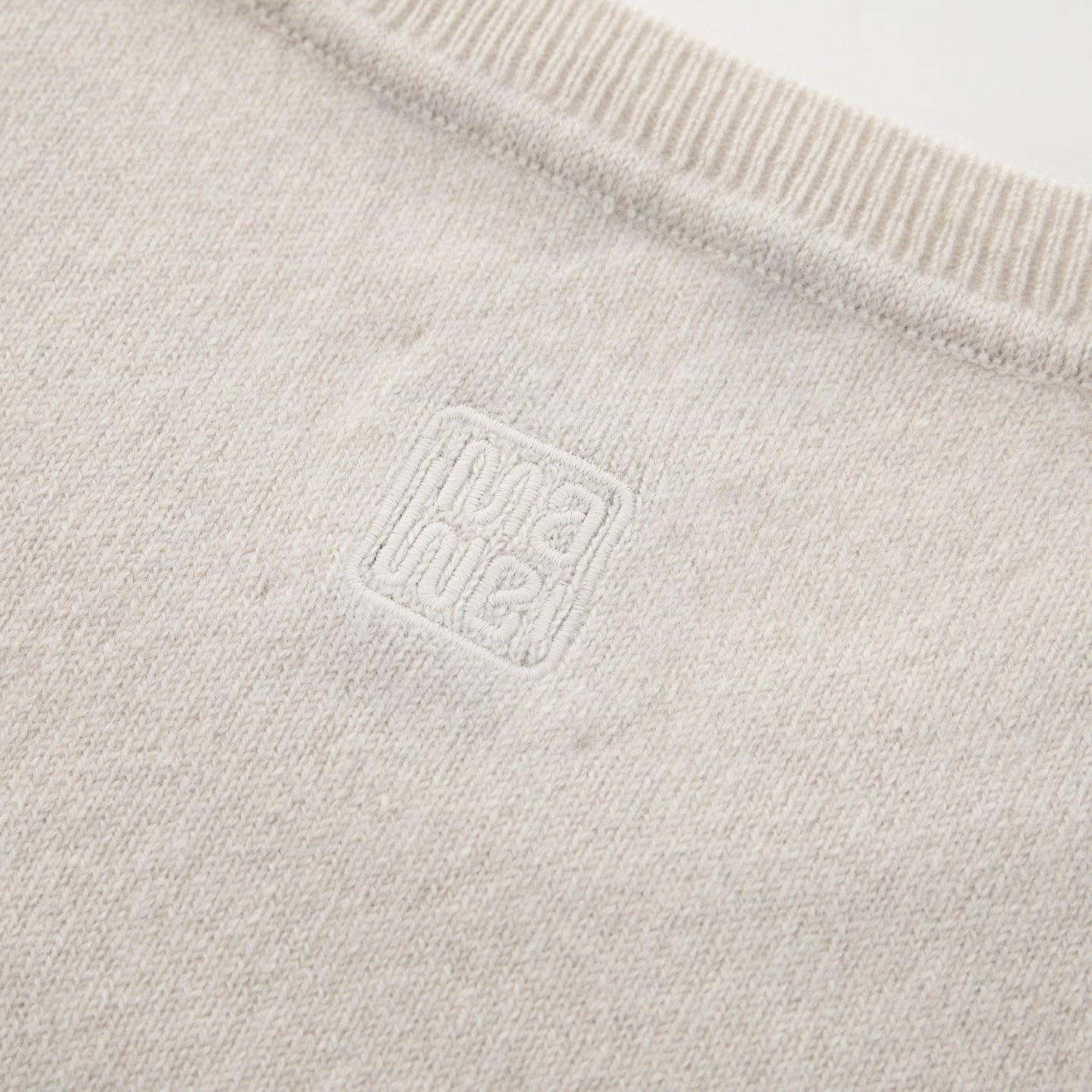 MA03 Cashmere Short Sleeve Crewneck Sweater by Mawei, off white, fabric and  logo embroidery detail, close-up, back view.