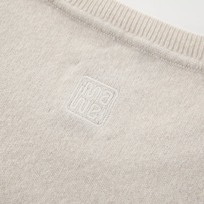 MA03 Cashmere Short Sleeve Crewneck Sweater by Mawei, off white, fabric and  logo embroidery detail, close-up, back view.