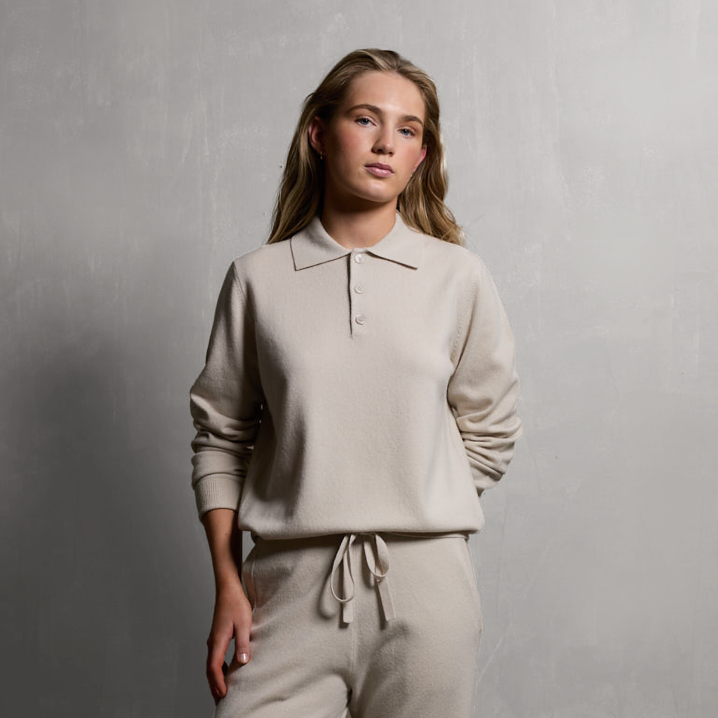 MA44 Cashmere Trousers and MA25 Cashmere Polo Sweater by Mawei, off white, front view, female model.