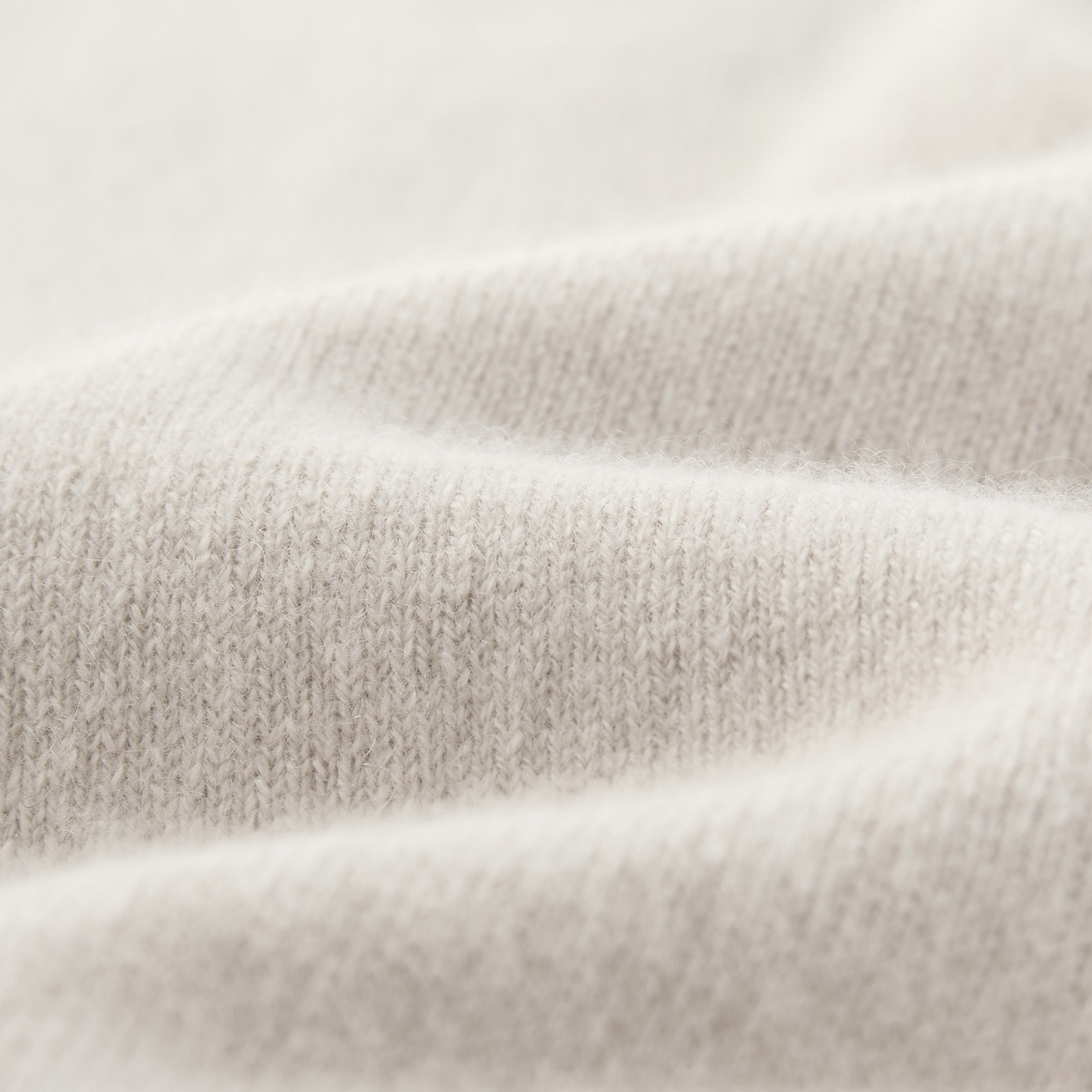 MA25 Cashmere Polo Sweater by Mawei, off-white, fabric texture close-up.