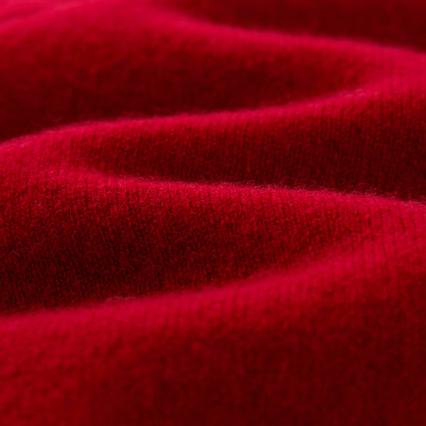Cashmere Sweater by Mawei, red fabric detail close-up.