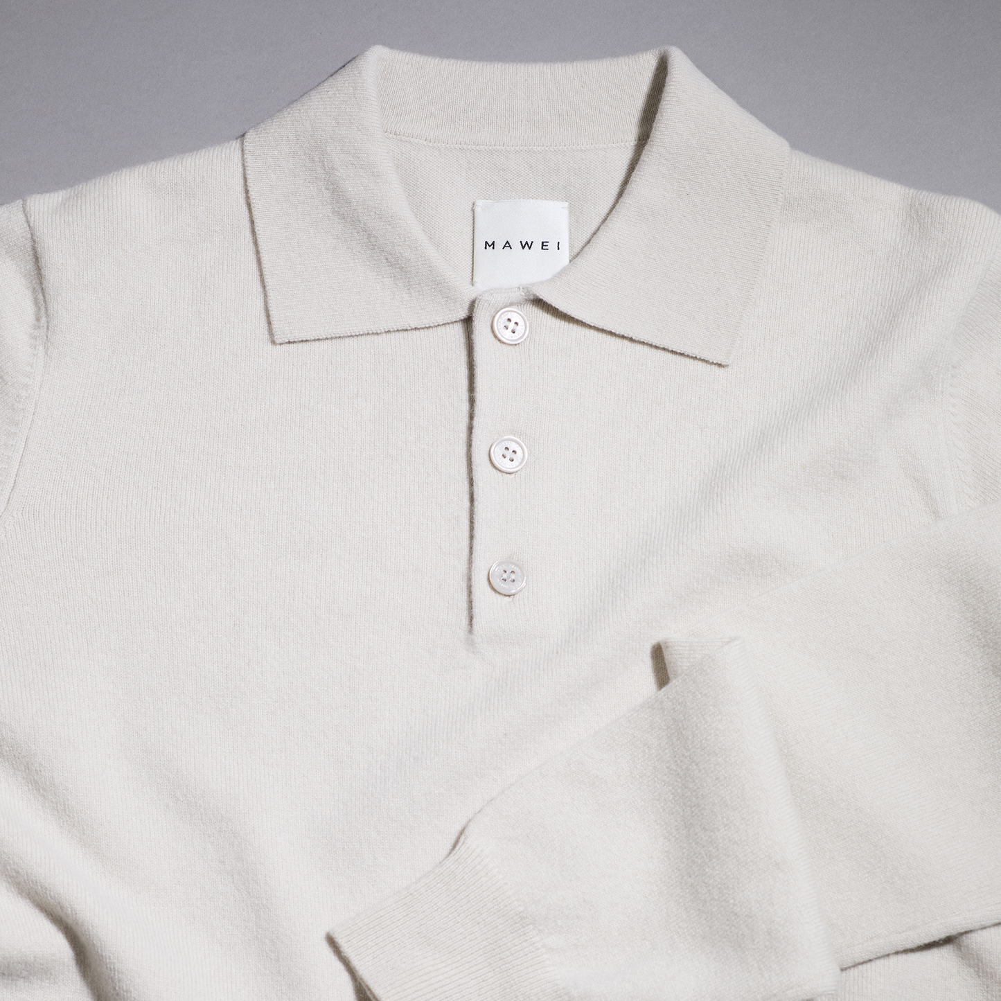 MA25 Cashmere Polo Sweater by Mawei, off white, flat lay.