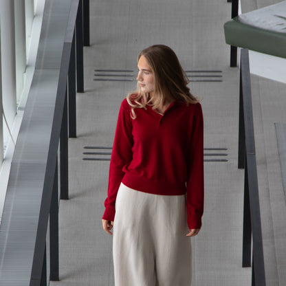 MA05 Cashmere Polo Sweater red and MA34 Cashmere A‑Line Skirt off white by Mawei, front view, female model.