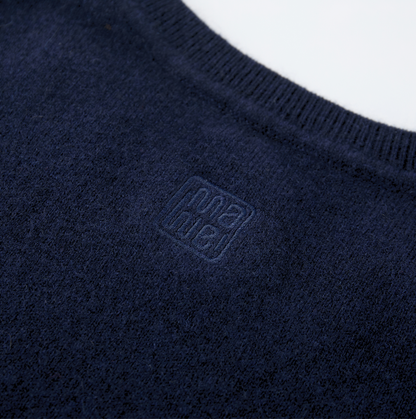 MA03 Cashmere Short Sleeve Crewneck Sweater by Mawei, navy blue, fabric and logo embroidery  detail close-up, back view.