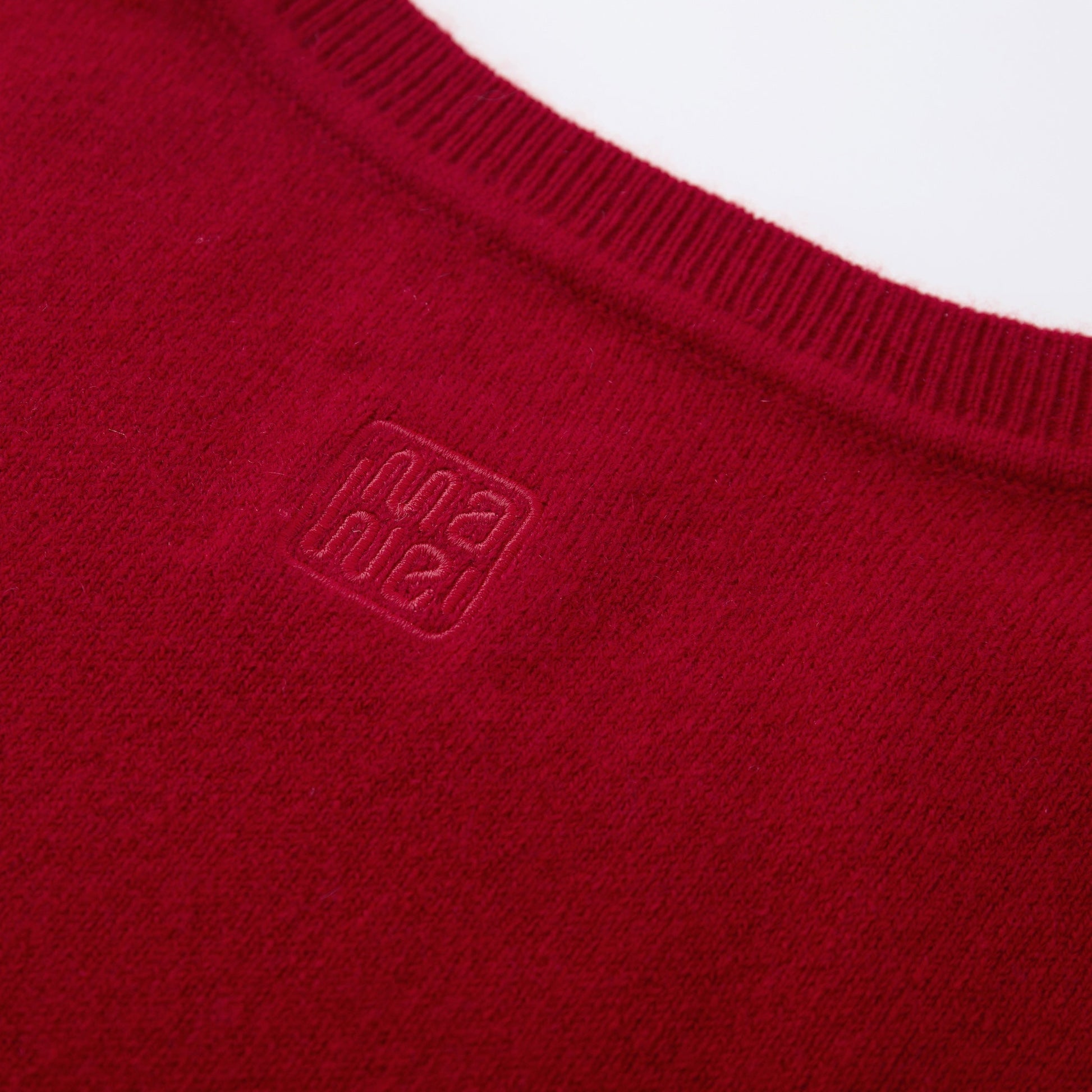 MA03 Cashmere Short Sleeve Crewneck Sweater by Mawei, red, fabric and logo embroidery detail close-up, back view.