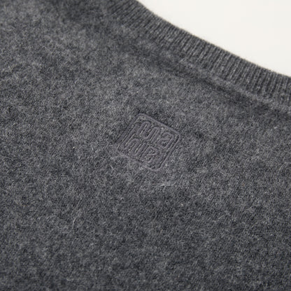 MA03 Cashmere Short Sleeve Crewneck Sweater by Mawei, grey, fabric and logo embroidery detail close-up, back view.
