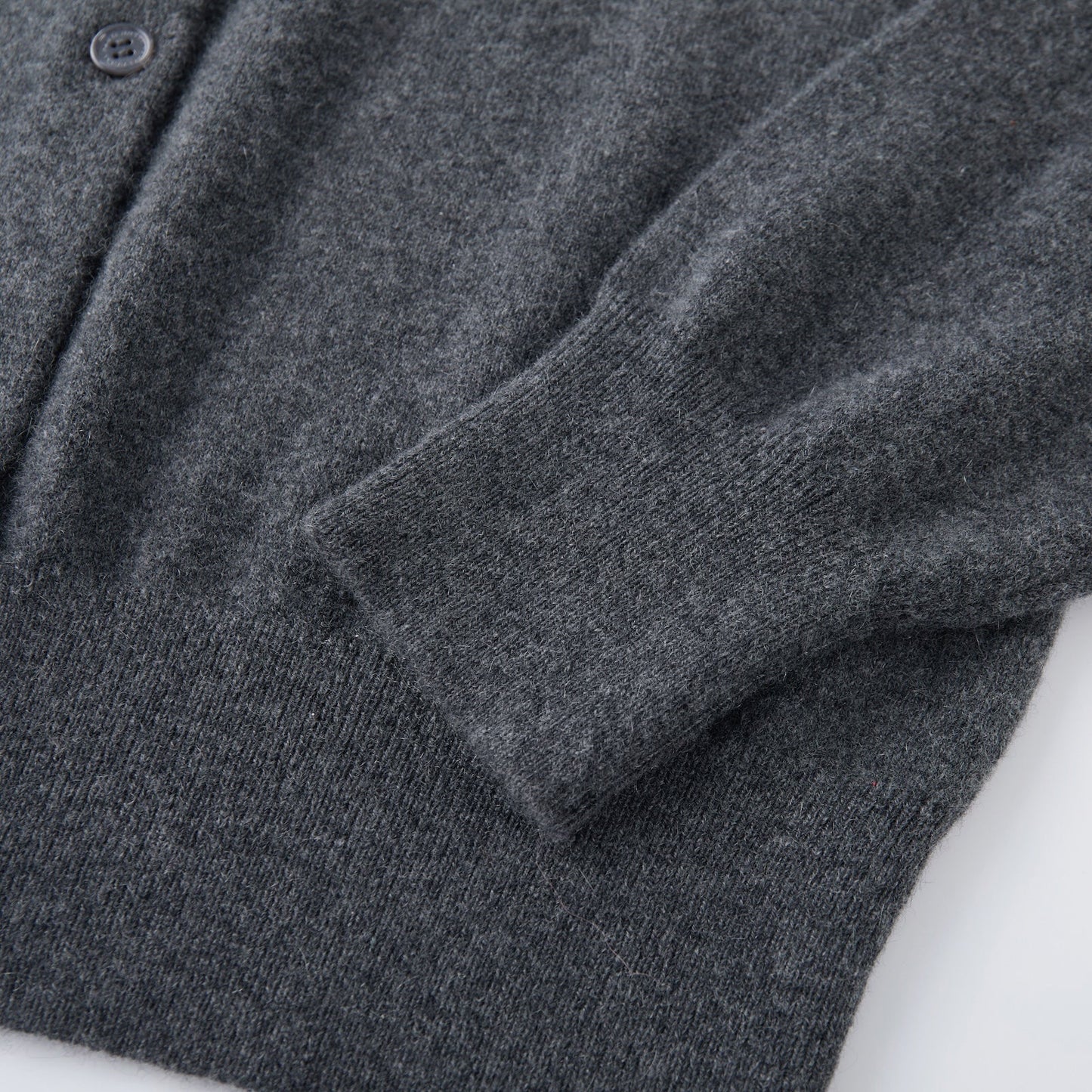 MA06 Cashmere Crewneck Cardigan by Mawei, cuff, hem rib details close-up.
