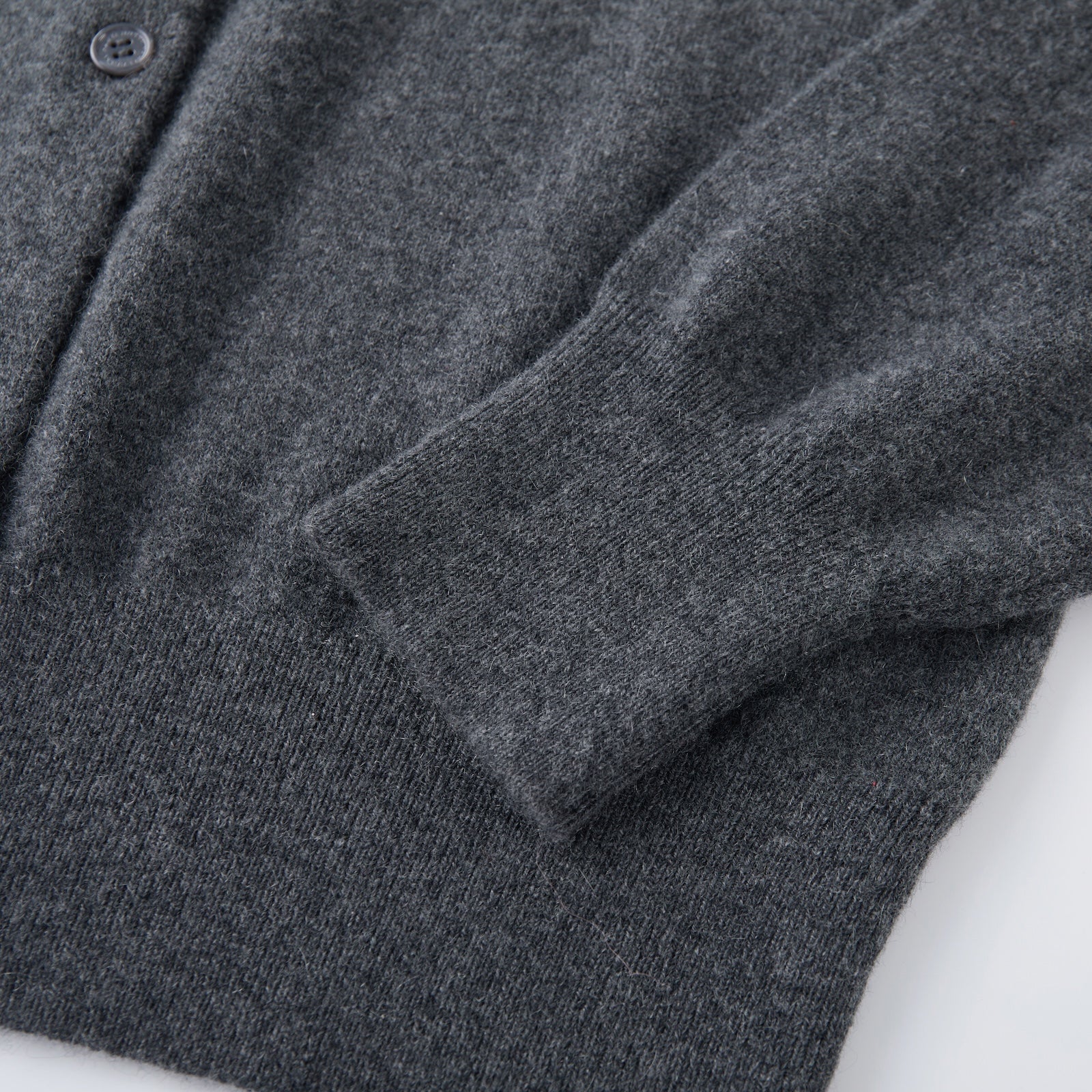 MA06 Cashmere Crewneck Cardigan by Mawei, cuff, hem rib details close-up.