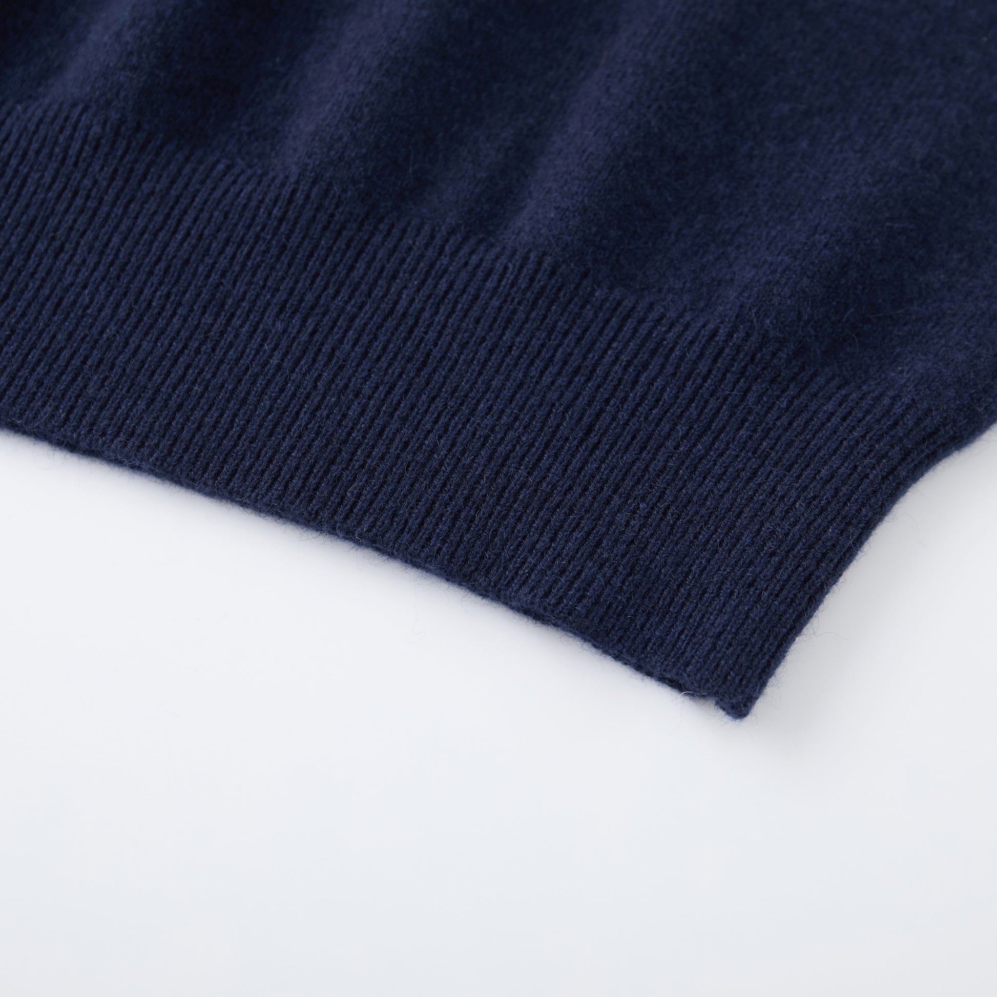 MA03 Cashmere Short Sleeve Crewneck Sweater by Mawei, navy blue, hem rib  detail close-up.