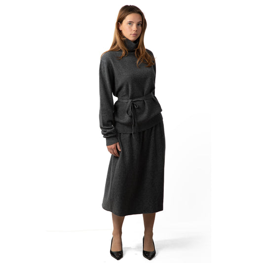 MA33 Cashmere Midi Skirt, MA21 Cashmere Turtleneck Unisex sweater, MA81 Cashmere Ribbon, belt by Mawei, grey, front view, female model.