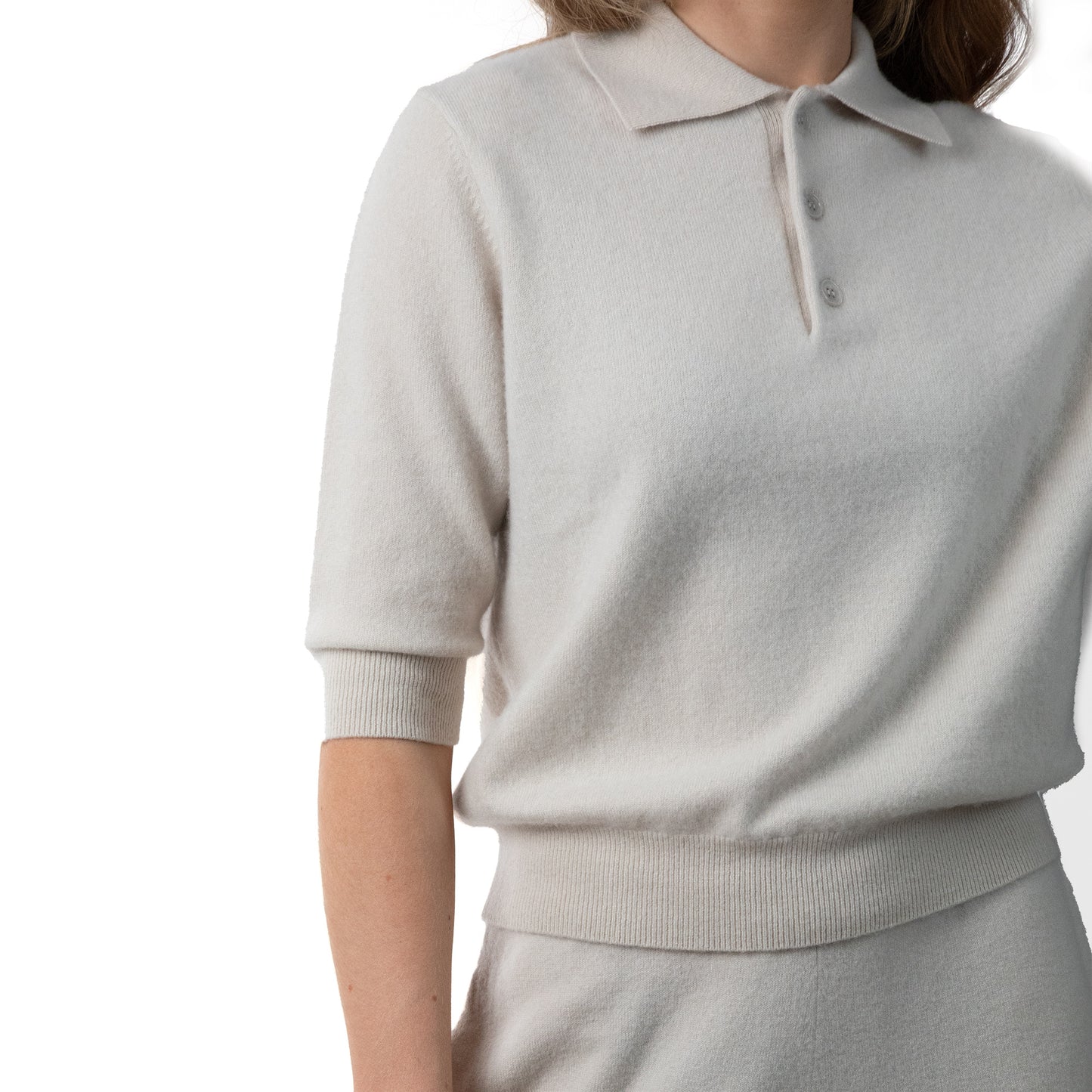 MA09 Cashmere Short Sleeve Polo Sweater by Mawei, off white, female model, close up, front view.