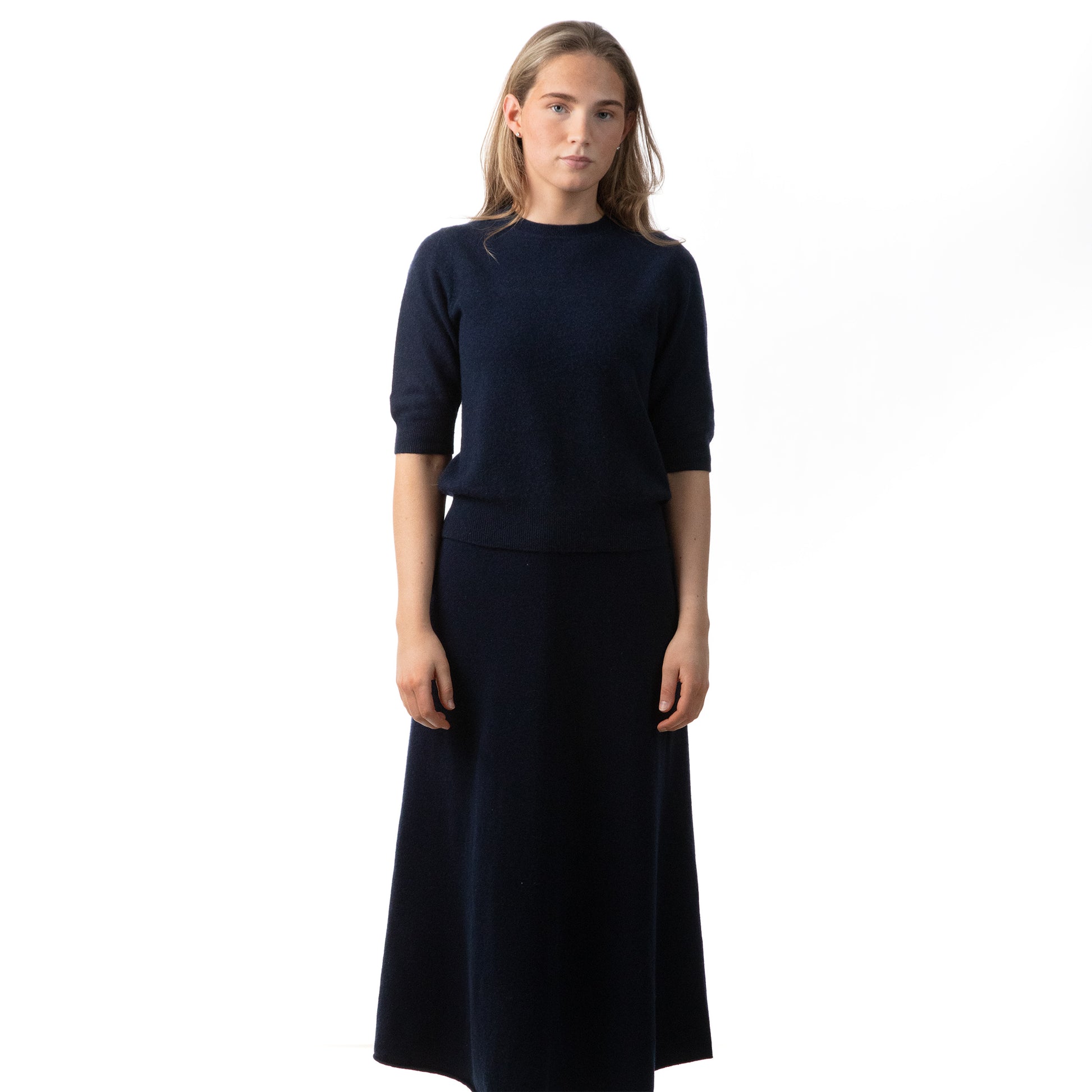 MA33 Cashmere Skirt  with Pockets and MA03 Short Sleeve Crewneck Sweater by Mawei, navy blue, front view, female model.