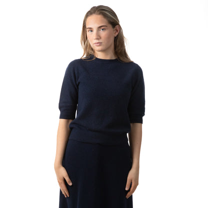MA33 Cashmere Skirt  with Pockets and MA03 Short Sleeve Crewneck Sweater by Mawei, navy blue, front view, female model.