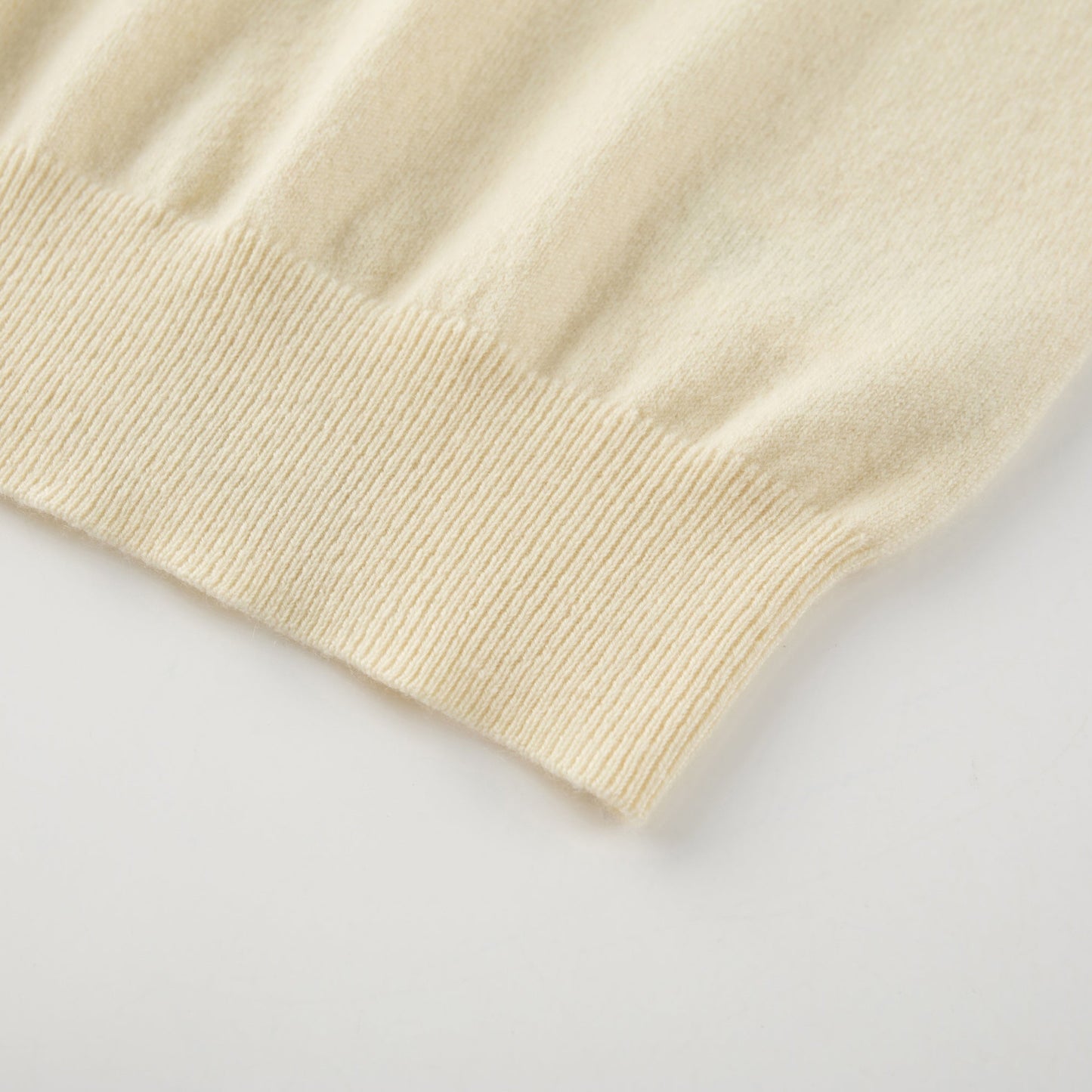 MA01 Cashmere Sleeveless Crewneck Sweater by Mawei, yellow cream, hem rib close up.