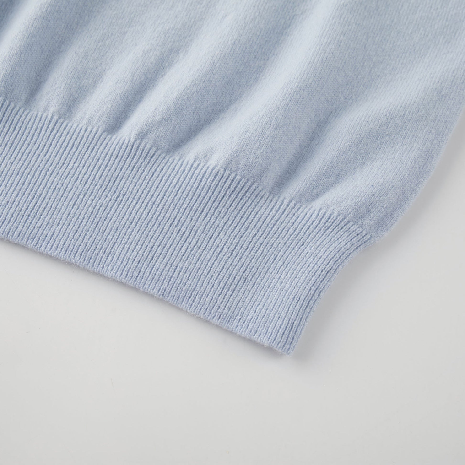 MA03 Cashmere Short Sleeve Crewneck Sweater by Mawei, blue, hem rib  detail close-up.