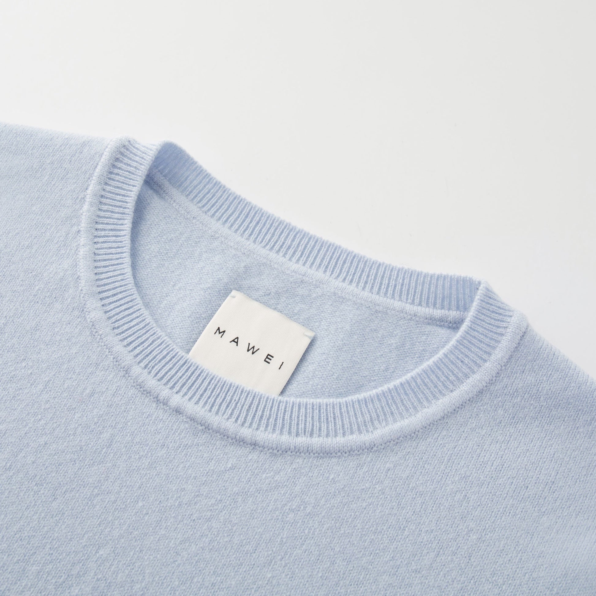MA03 Cashmere Short Sleeve Crewneck Sweater by Mawei, blue, neck rib detail close-up.