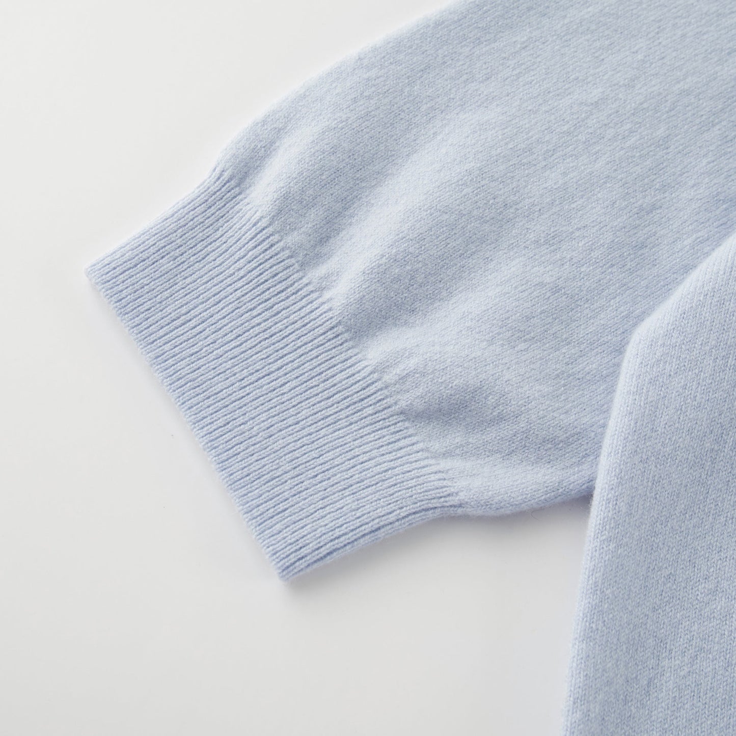 MA03 Cashmere Short Sleeve Crewneck Sweater by Mawei, blue, cuff rib detail close-up.