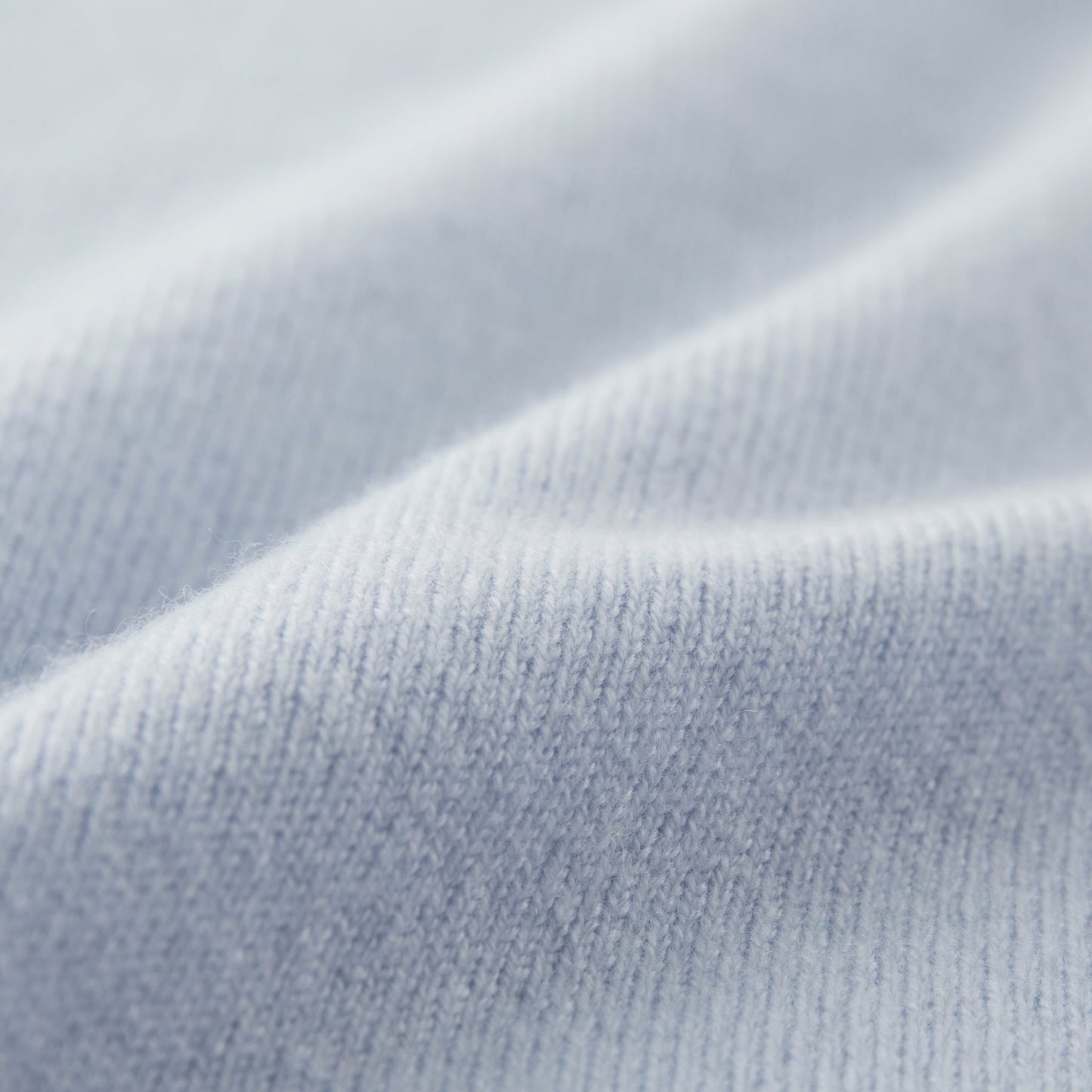 Cashmere Sweater by Mawei, blue fabric detail close-up.