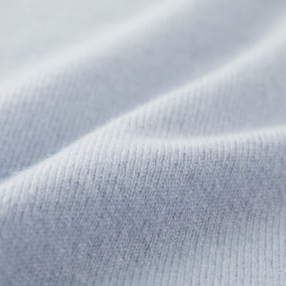 Cashmere Sweater by Mawei, blue fabric detail close-up.