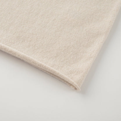 MA04 Short Sleeve Cashmere Tee with Pocket by Mawei, off white, bottom rolled edge close up.