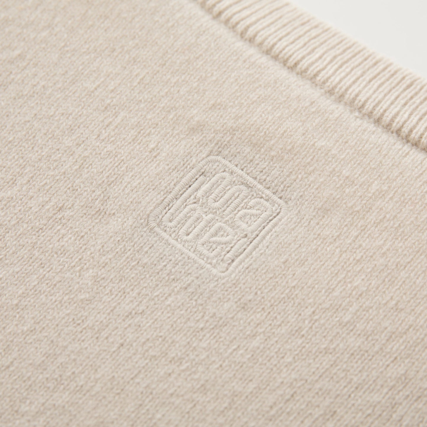 MA04 Short Sleeve Cashmere Tee with Pocket by Mawei, off white, fabric and logo embroidery close up,  back view
