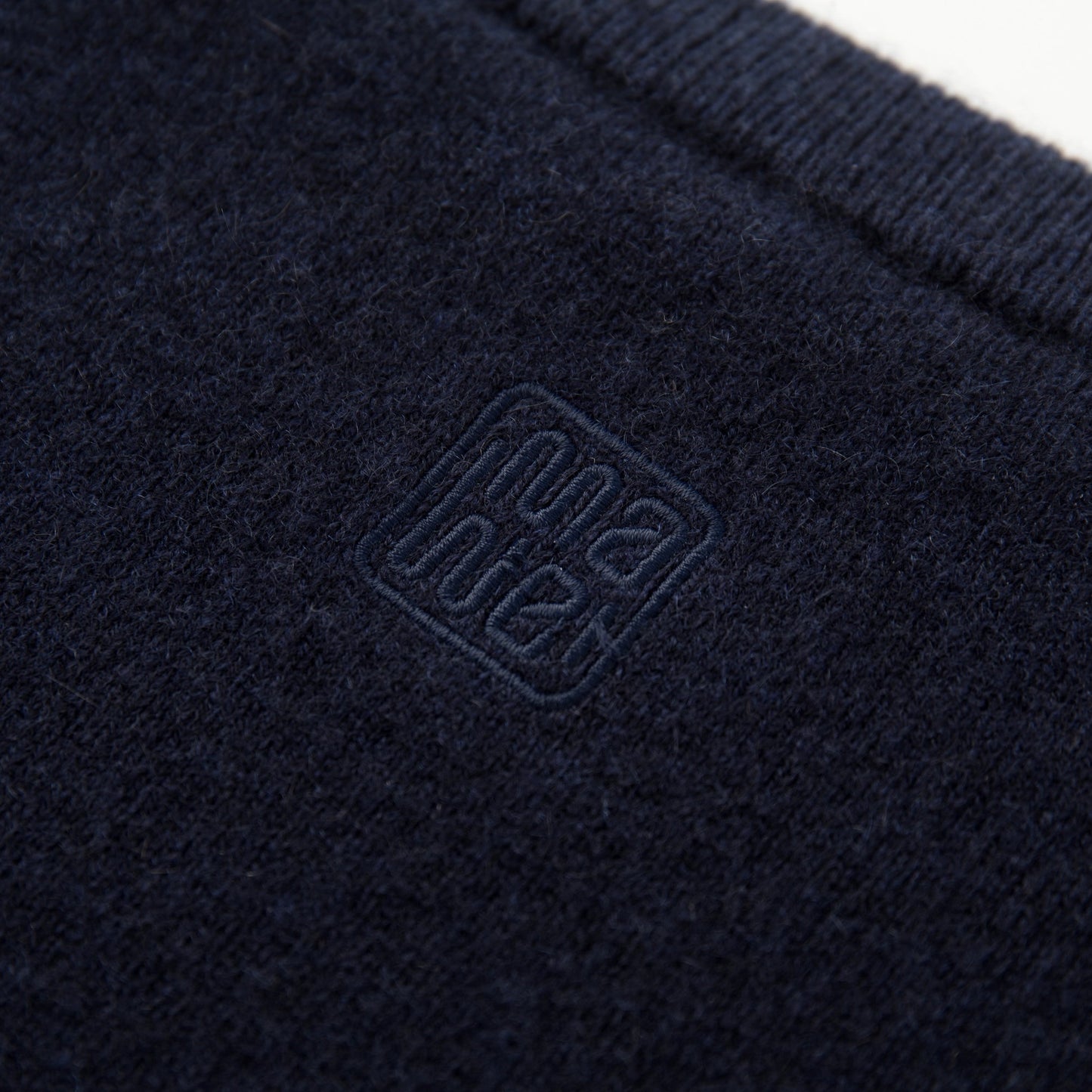 MA04 Short Sleeve Cashmere Tee with Pocket by Mawei, navy blue, fabric and logo embroidery close up,  back view