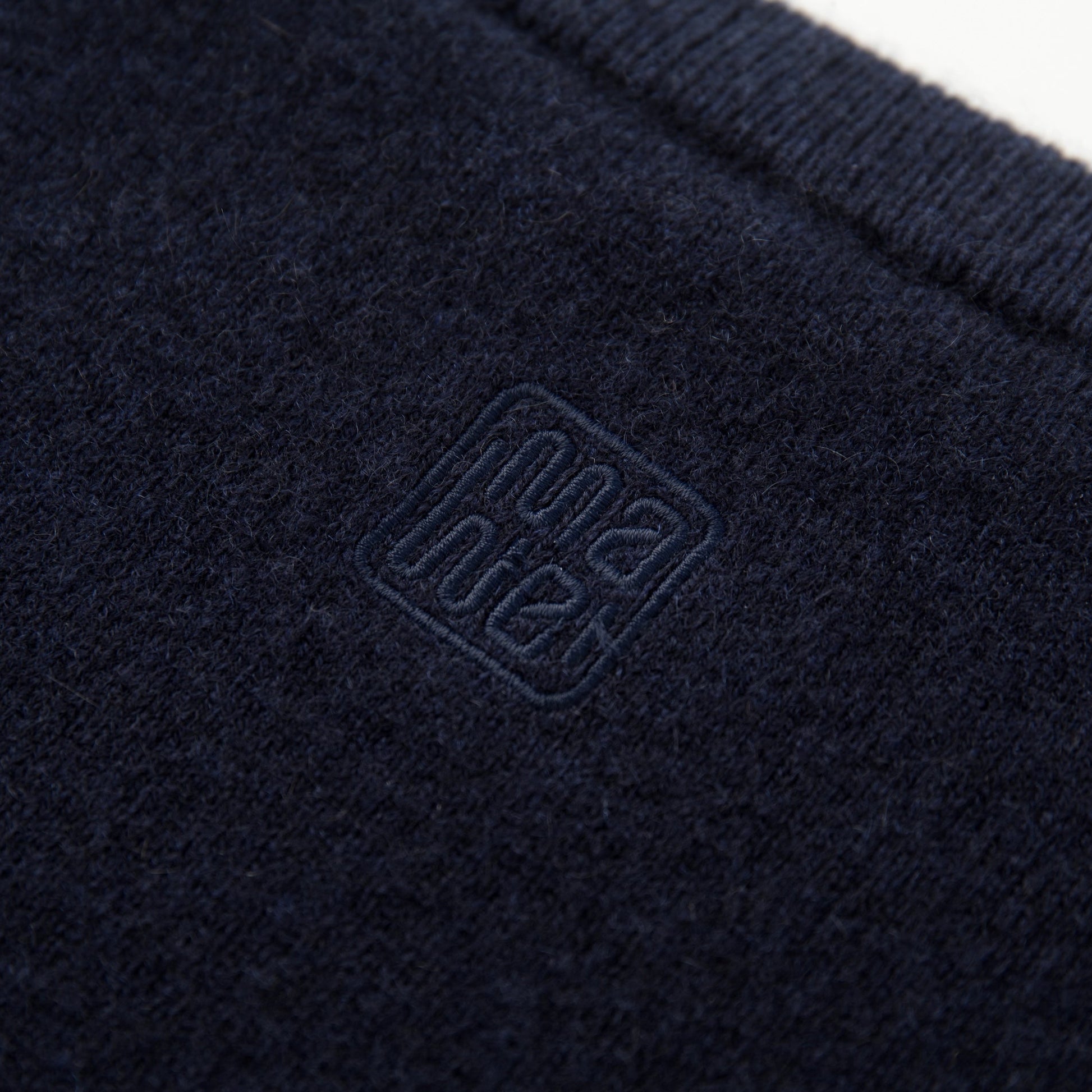 MA04 Short Sleeve Cashmere Tee with Pocket by Mawei, navy blue, fabric and logo embroidery close up,  back view