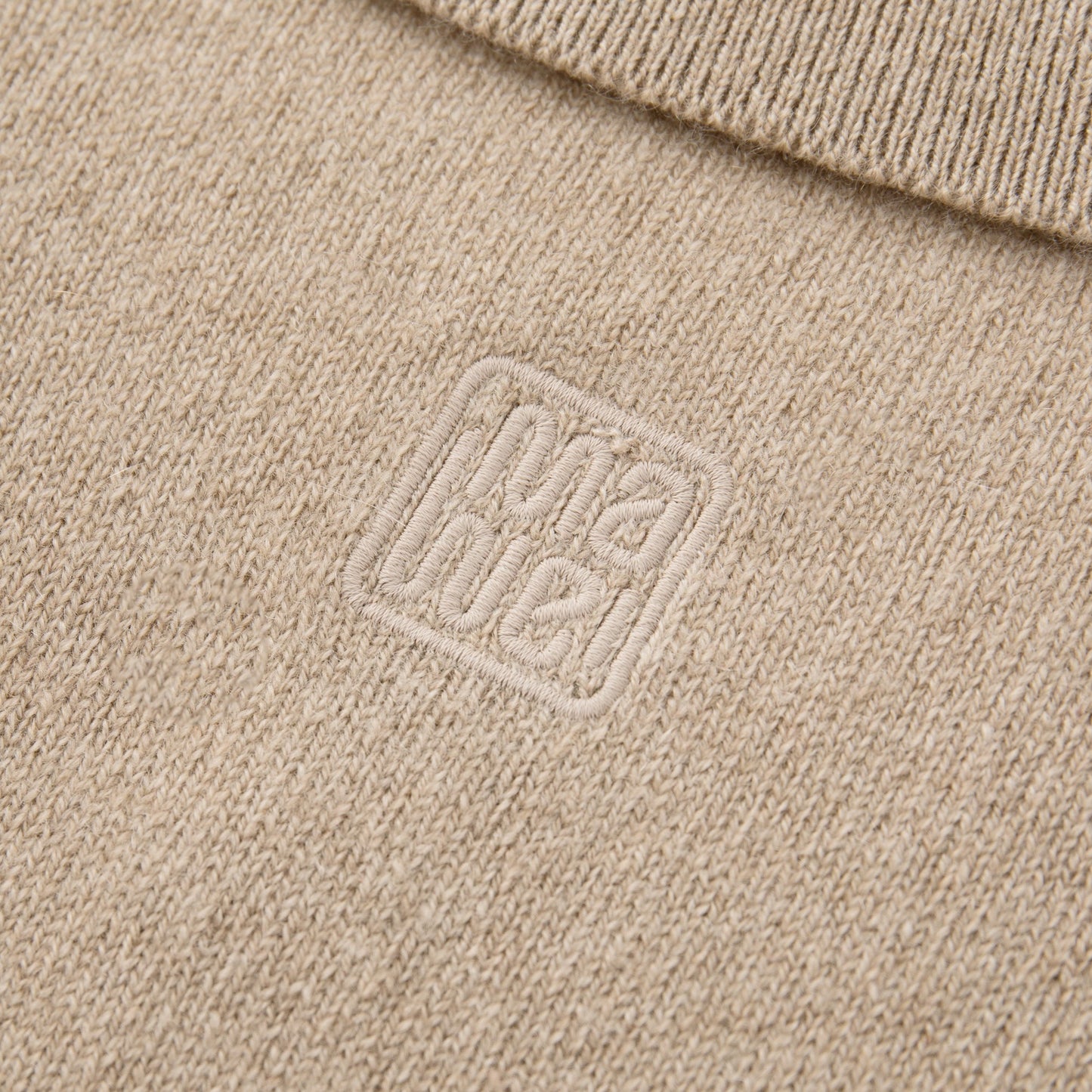 MA25 Cashmere Polo Sweater by Mawei, beige camel, fabric and logo embroidery close up, back view