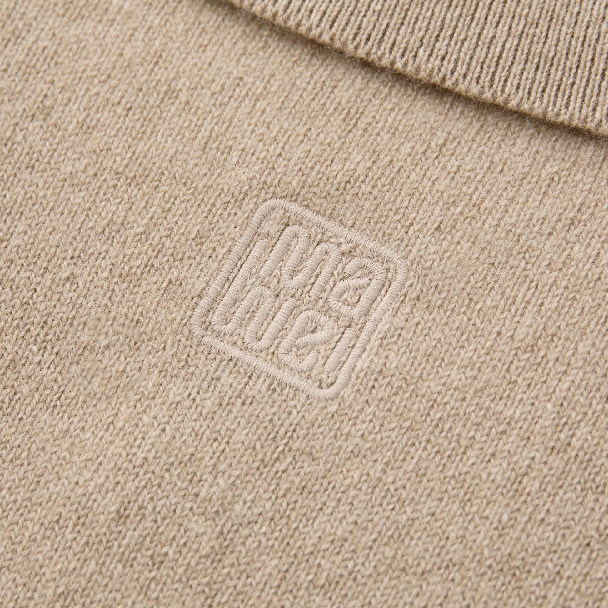MA25 Cashmere Polo Sweater by Mawei, beige camel, fabric and logo embroidery close up, back view